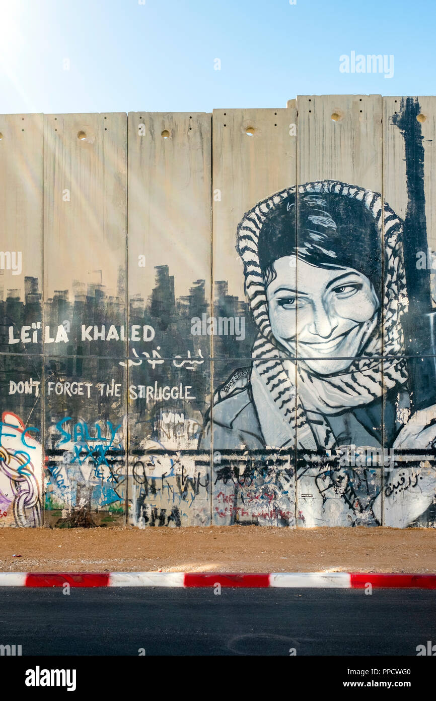 View of graffiti commemorating Leila Khaled on Israeli West Bank Barrier separation wall, Bethlehem, West Bank, Palestine Stock Photo
