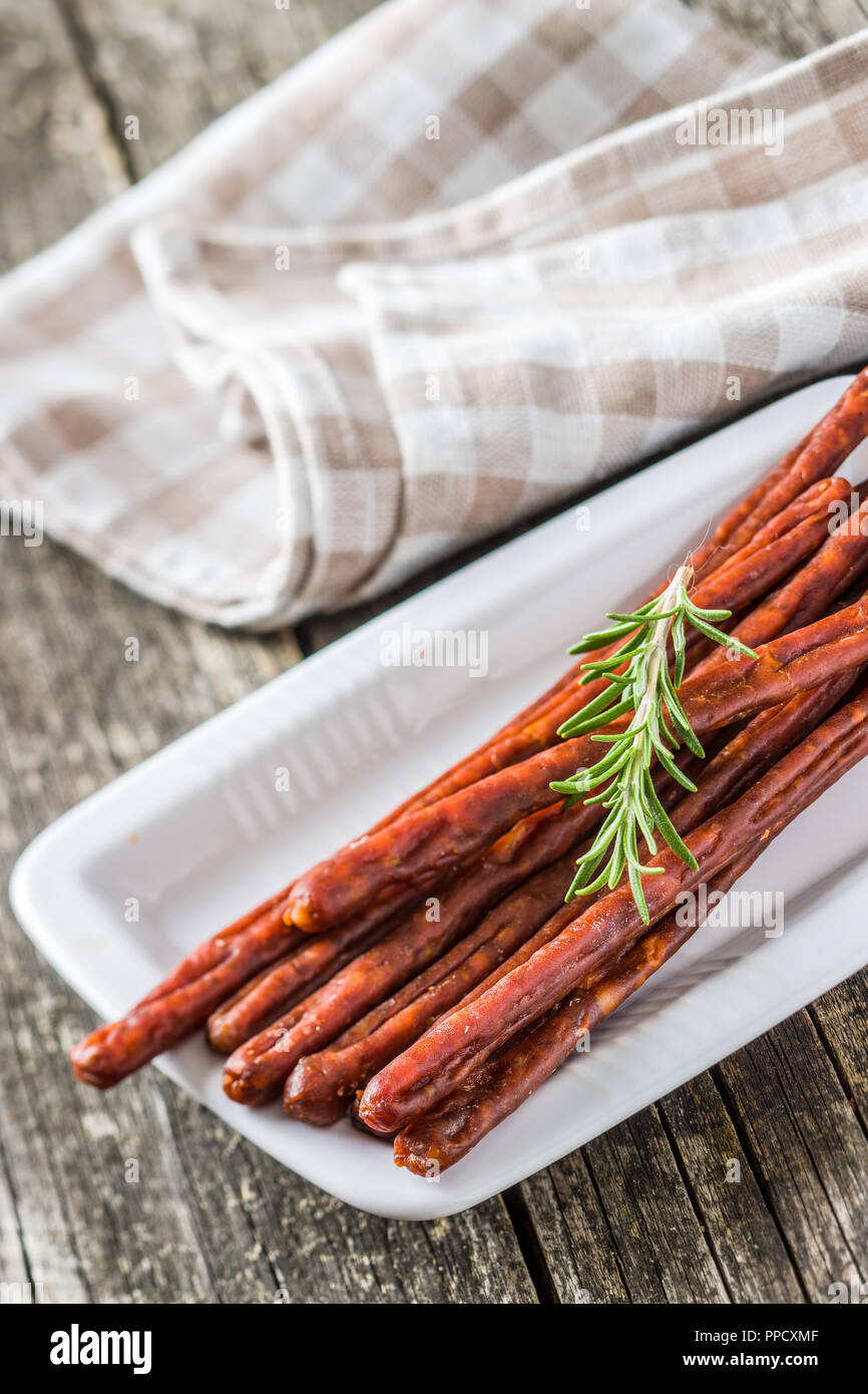 Sausage sticks snack. Chorizo snack on plate Stock Photo Alamy