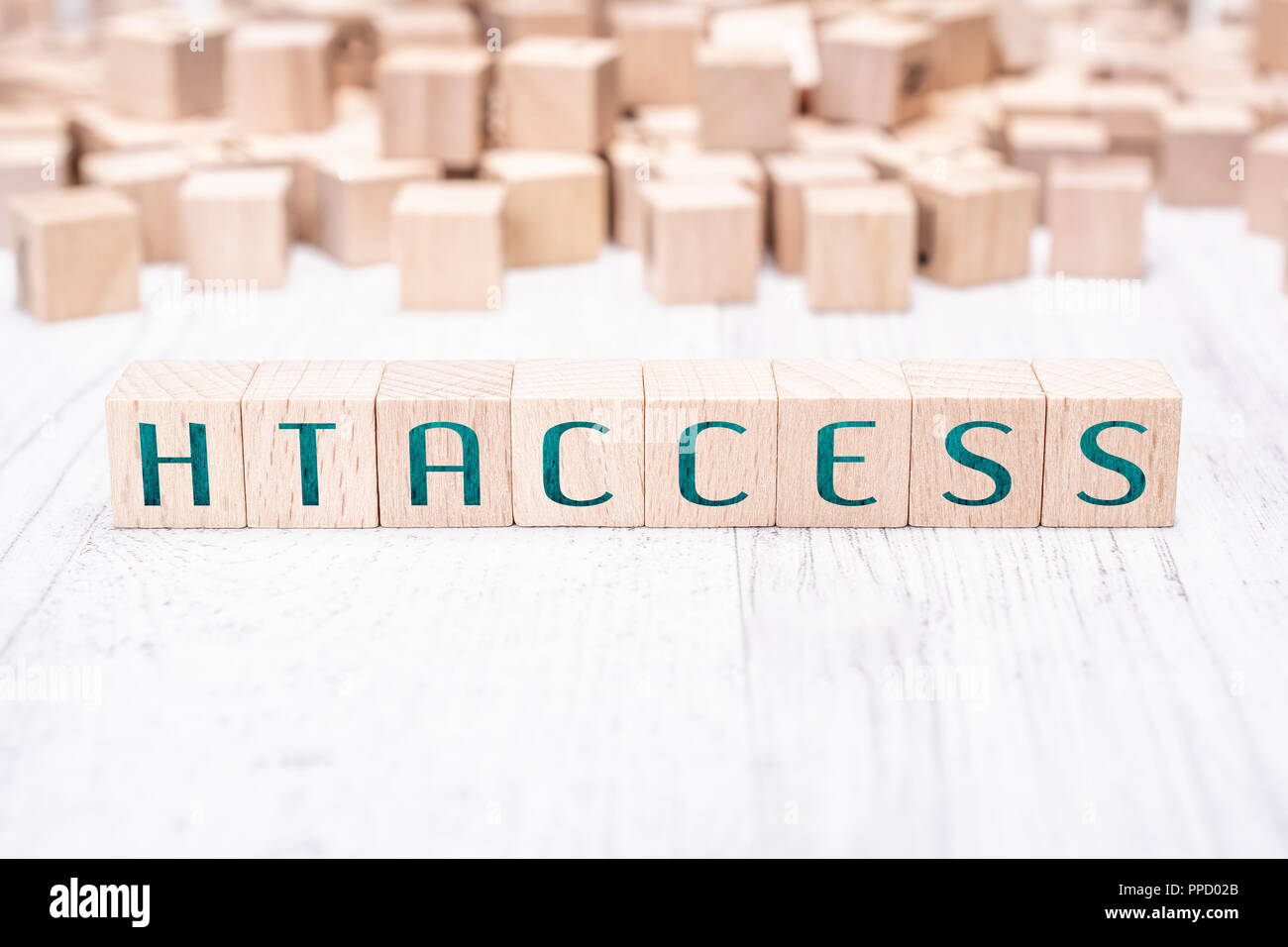The Word htaccess Formed By Wooden Blocks On A White Table Stock Photo