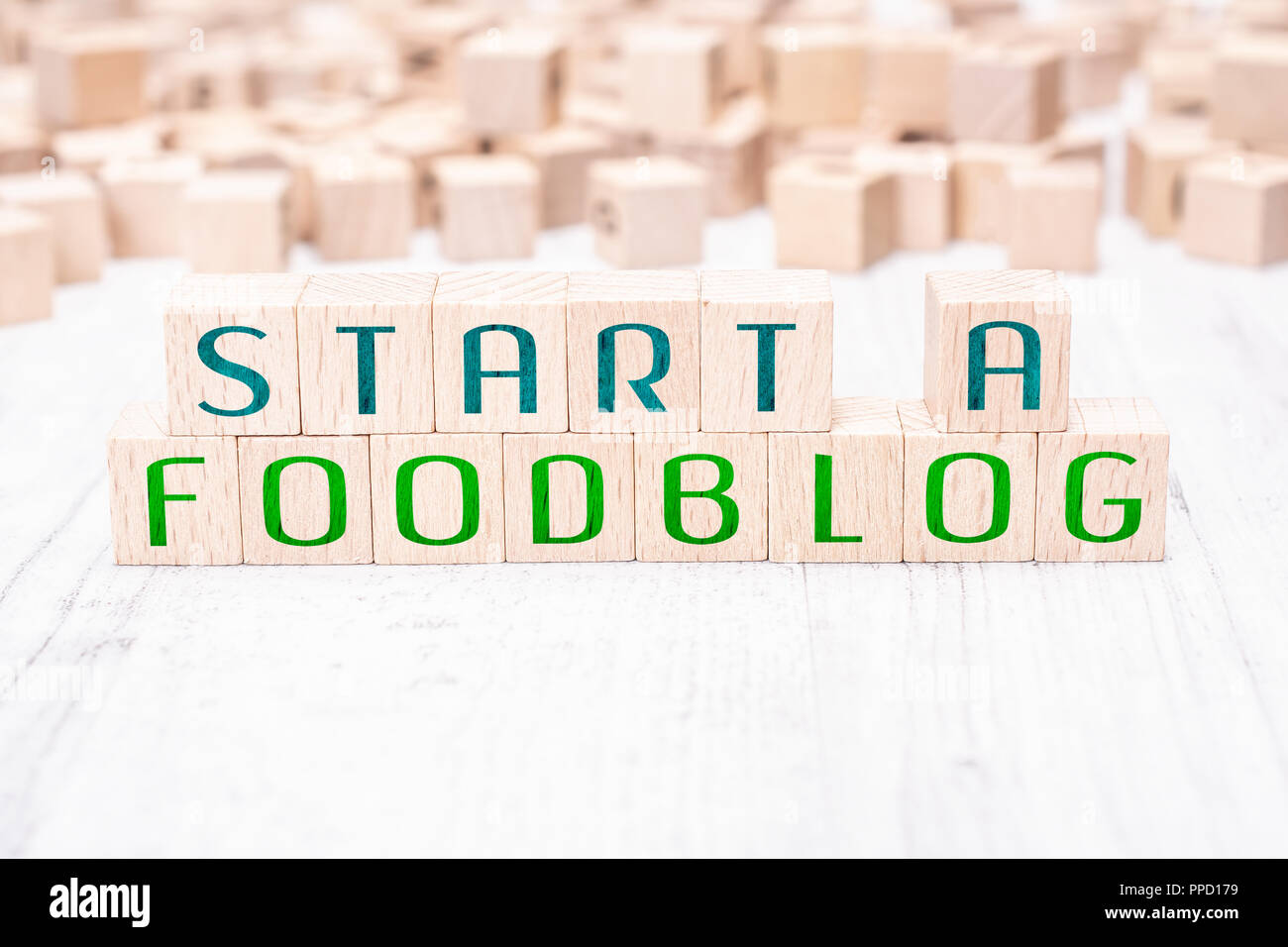 The Words Start A Foodblog Formed By Wooden Blocks On A White Table Stock Photo