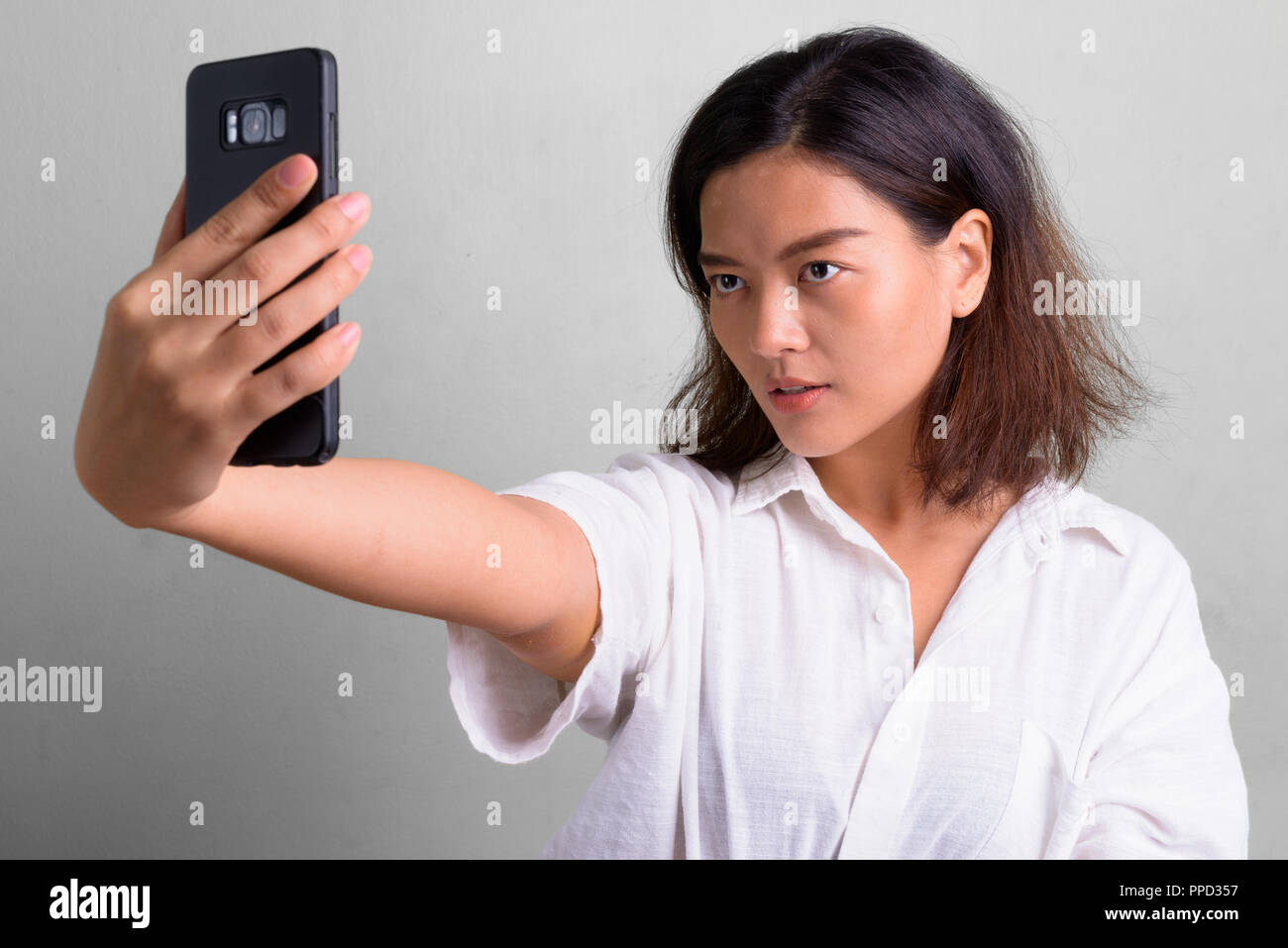 Portrait Of Young Beautiful Asian Woman With Short Hair Stock