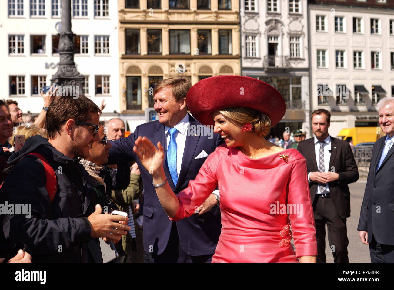 The royal couple of the Netherlands, King Willem-Alexander and Queen Maxima make a stop in Munich during their visit to Bavaria. Cheering people line the way of the royal couple to the reception in the Residenz. On the right, the Bavarian Prime Minister, Horst Seehofer. Stock Photo