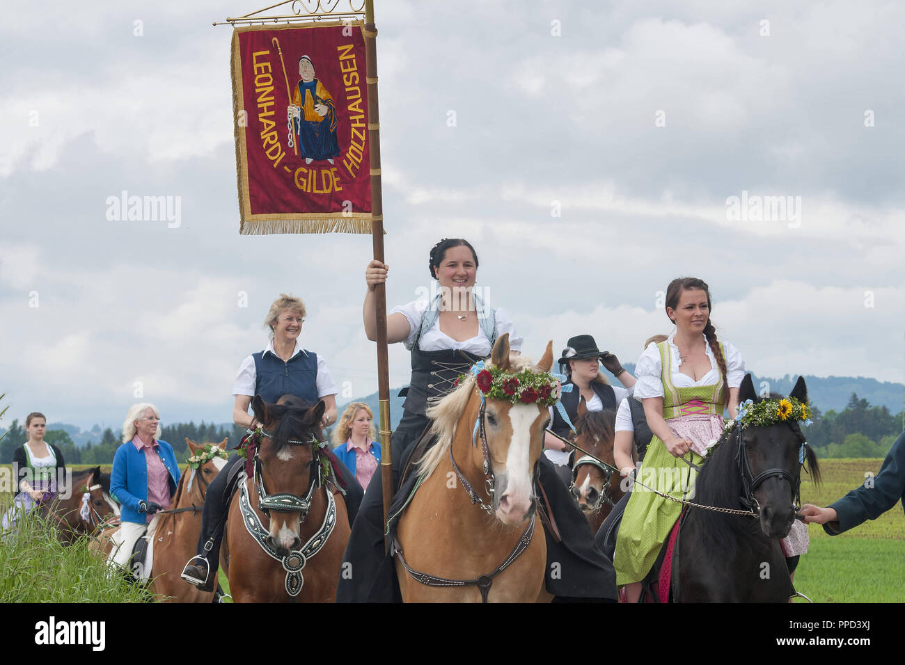 The traditional 'Leonhardiritt' in Holzhausen - Teisendorf, Oberbayern, Germany. During the parade which was first mentioned in 1612,  the beautifully dressed horses are being blessed. Stock Photo