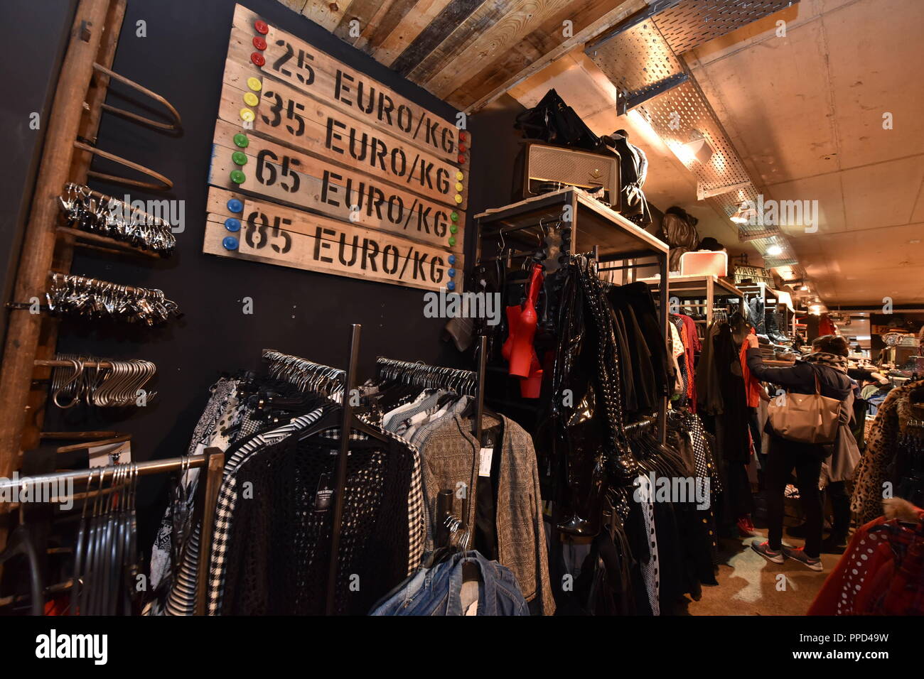 The "Pick & Weight" branch of the second-hand chain "Modemarkt Freestyle"  in the Schellingstrasse in Munich. The vintage clothing is paid by weight,  the different price categories are marked with four colors