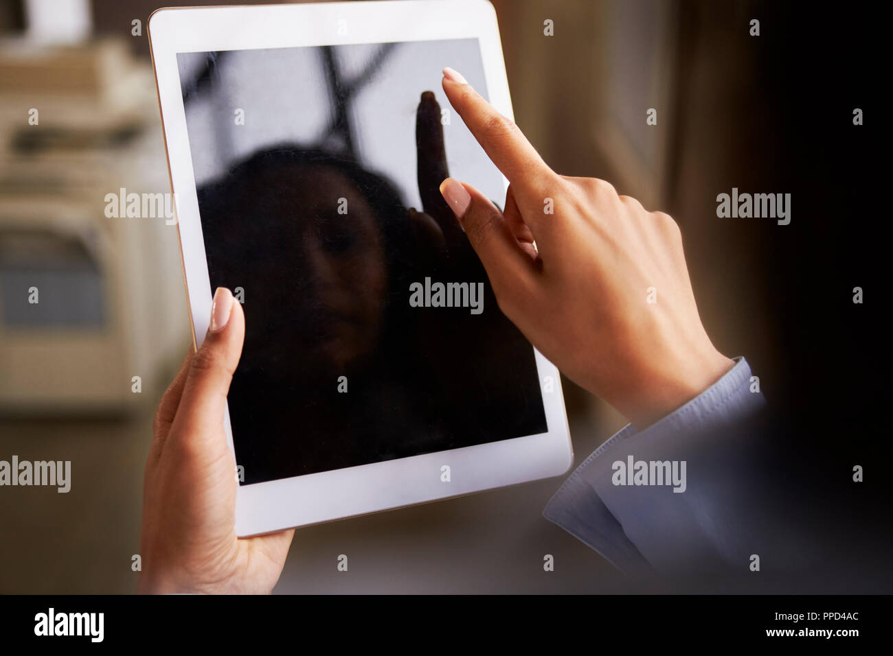 Close up of woman’s hands using tablet touchscreen Stock Photo