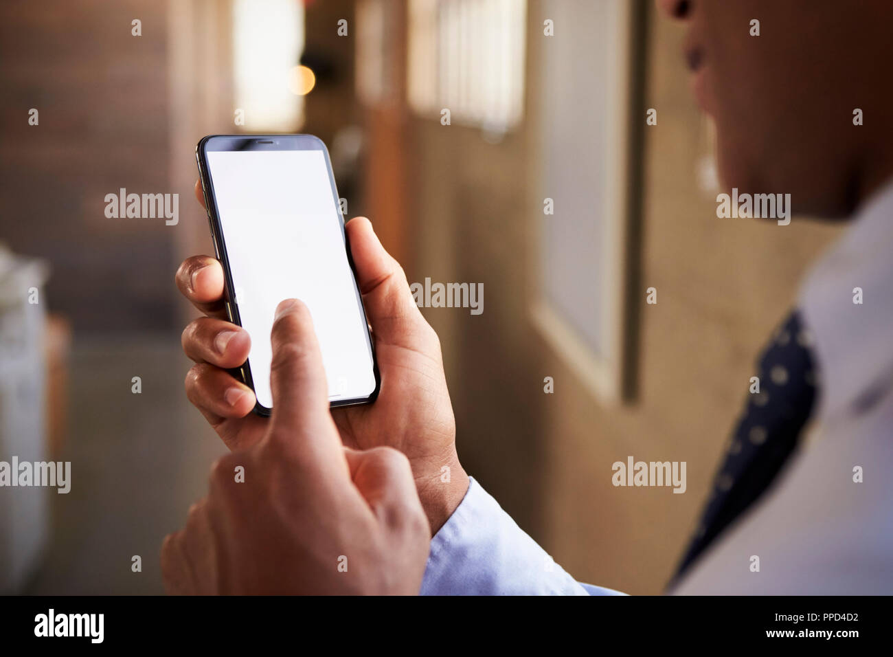 Close up of mixed race man using smartphone Stock Photo