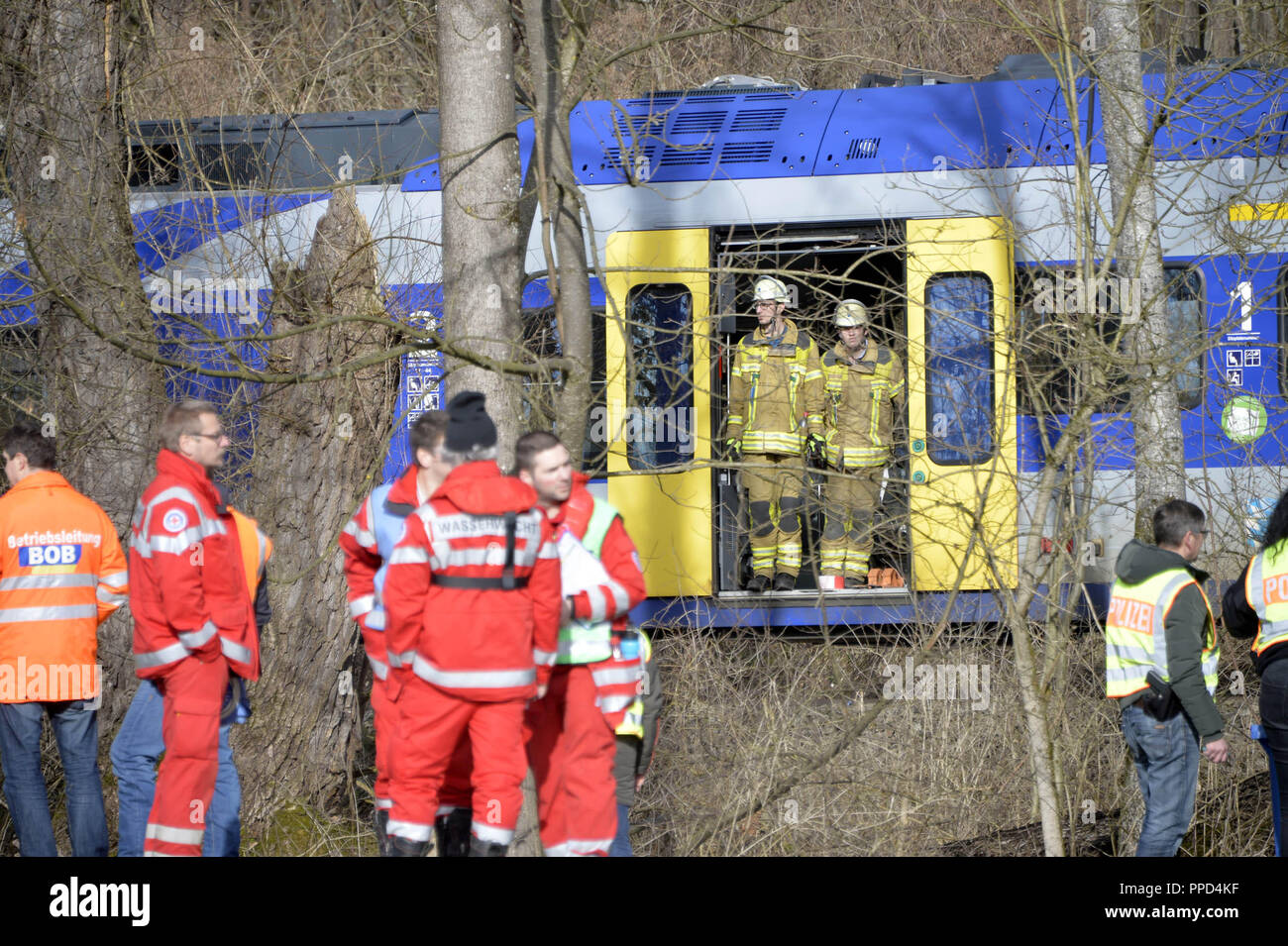 After the frontal collision of two meridian trains at Bad Aibling, rescue workers from the fire brigade, the police, the Bergwacht (mountain rescue service), Wasserwacht (water rescue service), the Red Cross and the Technisches Hilfswerk at the scene of the accident, trying to rescue the injured and salvage the bodies of those killed. Stock Photo