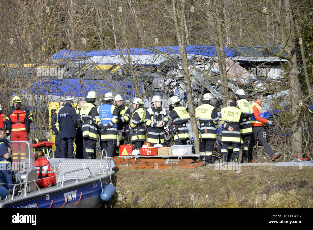 After the frontal collision of two meridian trains at Bad Aibling, rescue  workers from the fire brigade, the police, the Bergwacht (mountain rescue  service), Wasserwacht (water rescue service), the Red Cross and