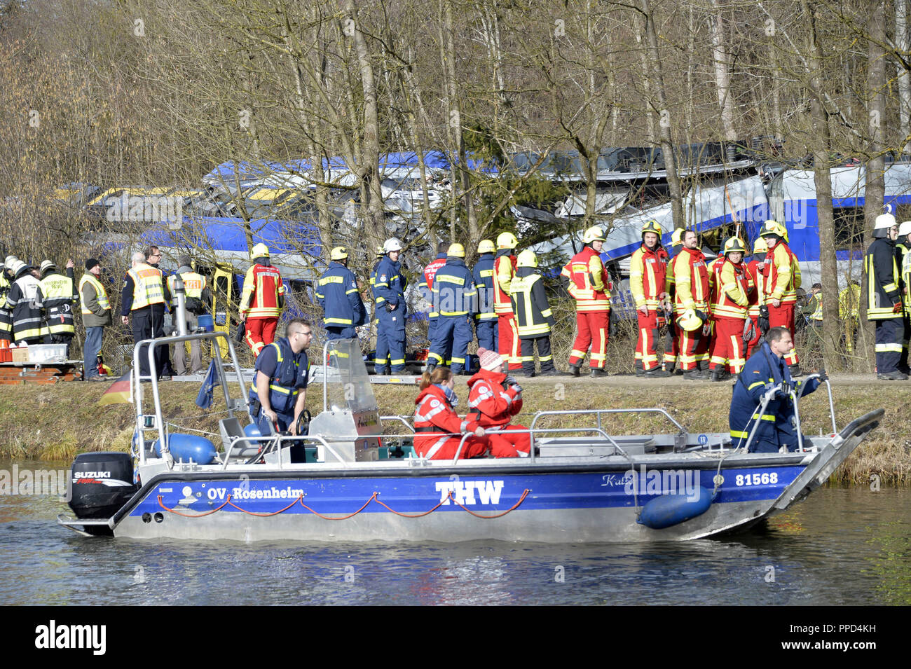 After the frontal collision of two meridian trains at Bad Aibling, rescue workers from the fire brigade, the police, the Bergwacht (mountain rescue service), Wasserwacht (water rescue service), the Red Cross and the Technisches Hilfswerk (in the picture with boats on the Mangfall) trying to rescue the injured and salvage the bodies of those killed. Stock Photo