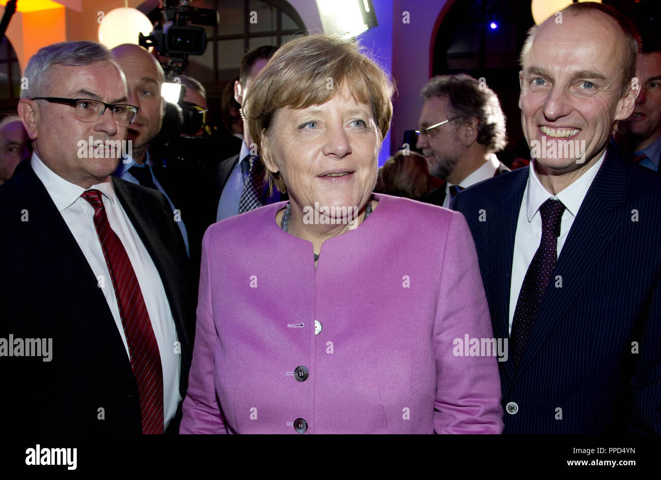 Chancellor Angela Merkel with the SZ editors Kurt Kister (l.) and Wolfgang Krach at the Night of the Sueddeutsche Zeitung in Humboldt Carre in Berlin. Stock Photo