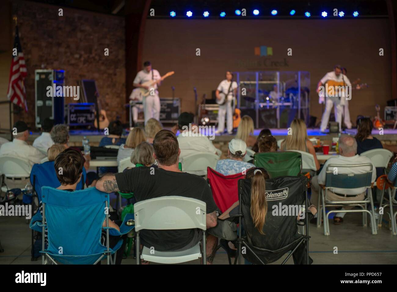 JOHNS CREEK, Ga. (Aug. 31, 2018) Audience members enjoy a performance by the U.S. Navy Band Country Current at the Mark Burkhalter Amphitheater at Newtown Park in Johns Creek, Georgia. Country Current is on a ten-day tour through Virginia, North Carolina, Georgia and Florida, entertaining audiences while connecting Americans to their Navy. Stock Photo