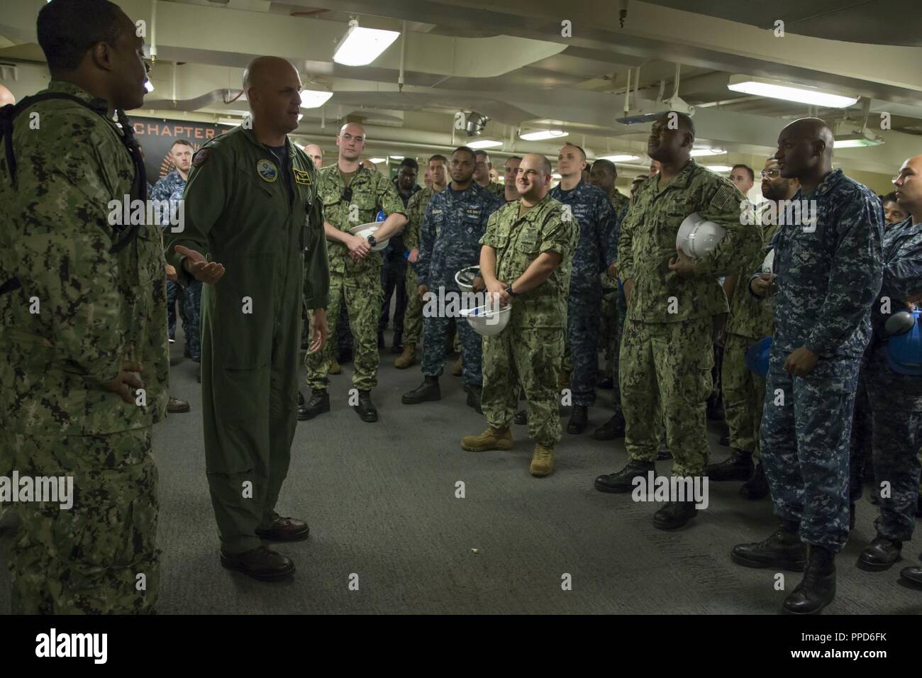 NEWPORT NEWS, Va. (Aug. 23, 2018) Capt. John J. Cummings, USS Gerald R. Ford's (CVN 78) commanding officer, addresses weapons department after Aviation Ordnanceman 1st Class Donald Harris, from Tallahassee, Fla., was awarded Aviation Ordnanceman of the Year. Harris will be promoted to chief petty officer next month. Stock Photo