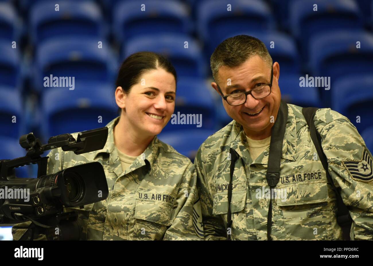 Master Sgt. Brandy Fowler, 107th Attack Wing broadcast journalist, and Tech. Sgt. Joe McKee, 163rd Attack Wing photo journalist, stop for a photo while documenting activities during Innovative Readiness Training Ola de Esperanza Sanadora, Guaynabo, Puerto Rico, Sept. 1, 2018. These two Air National Guard journalist were part of the IRT public affairs team authorized to document the more than 200 service members who are providing medical, dental and optometry care assisting local municipal authorities in addressing underserved community health and civic needs while performing joint military hum Stock Photo