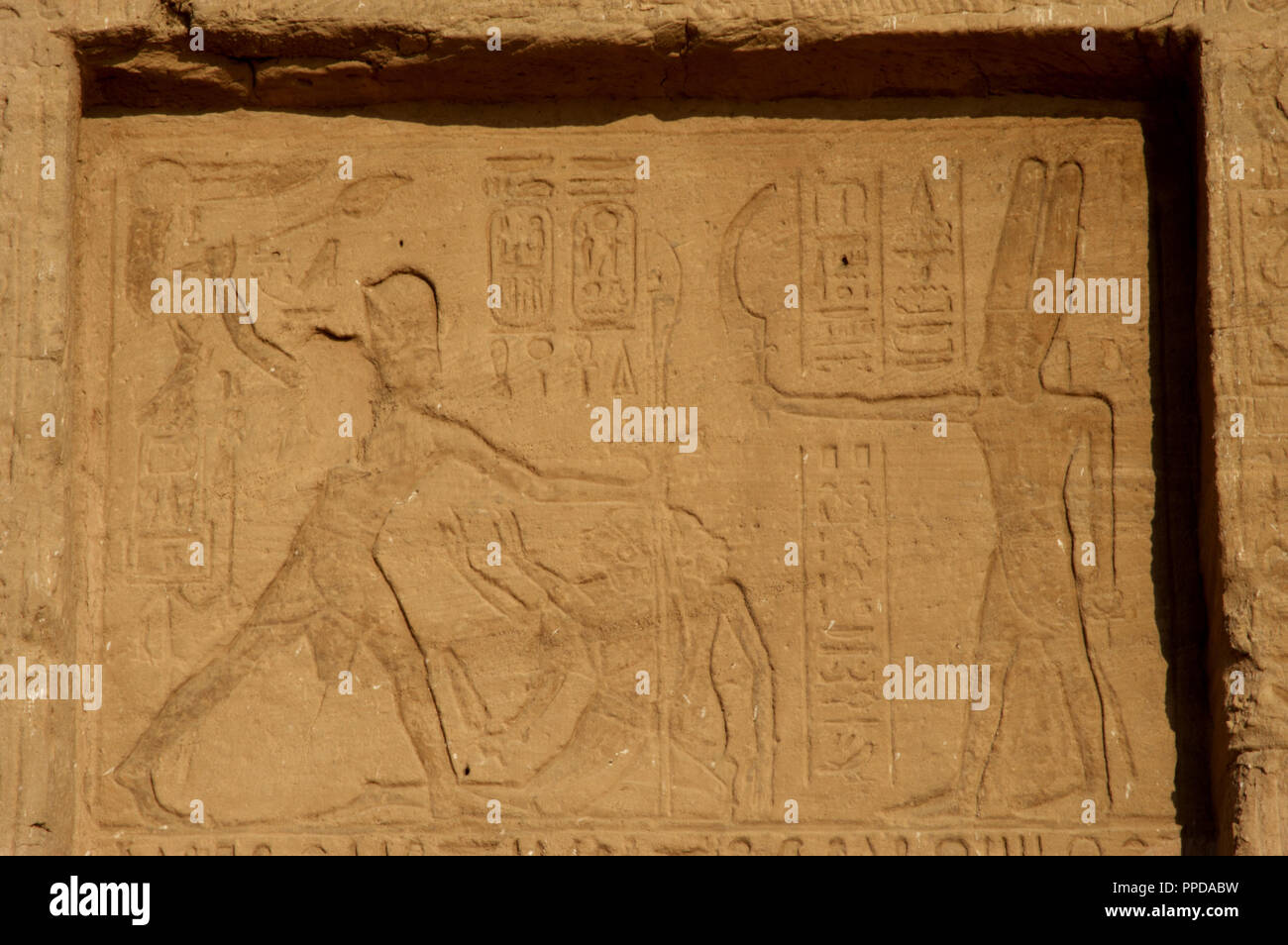 Egyptian art. Great Temple of Ramses II. 19th Dynasty. The pharaoh Ramses II offering war prisoners to god Amun. 19th Dynasty. New Kingdom. Abu Simbel. Egypt. Stock Photo