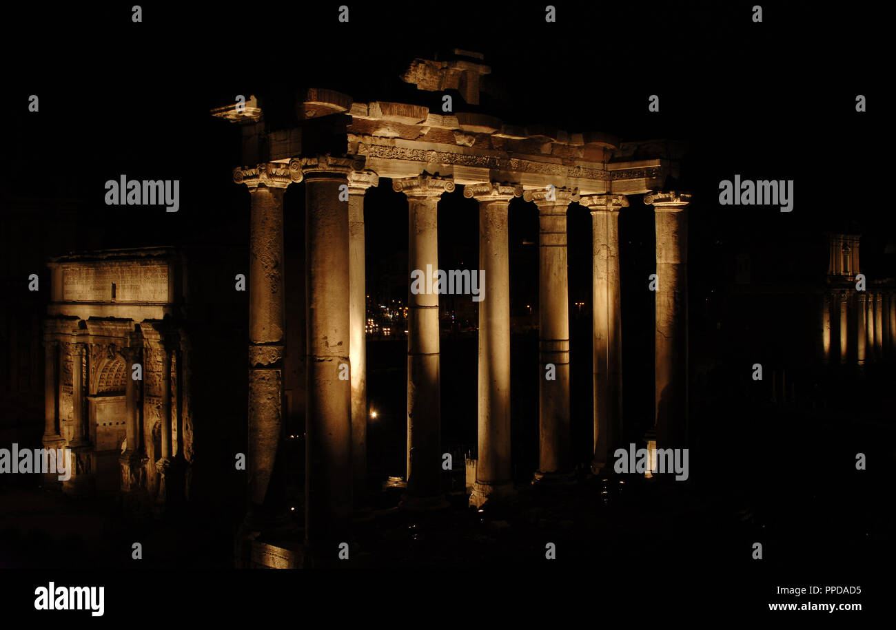 Italy. Rome. Roman Forum. Temple of Saturn, 5th century BC. Reconstructed in the 3rd century. Night view. Stock Photo