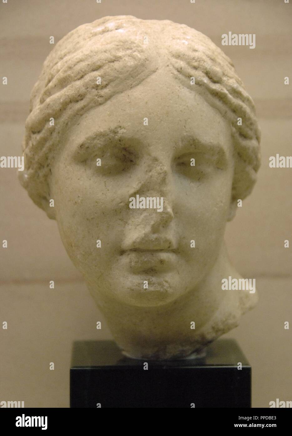 Greek Art. 4th century B.C. Marble head of Aphrodite influenced by the style of the sculptor Praxiteles. Archaeological Museum of Olympia. Greece. Stock Photo