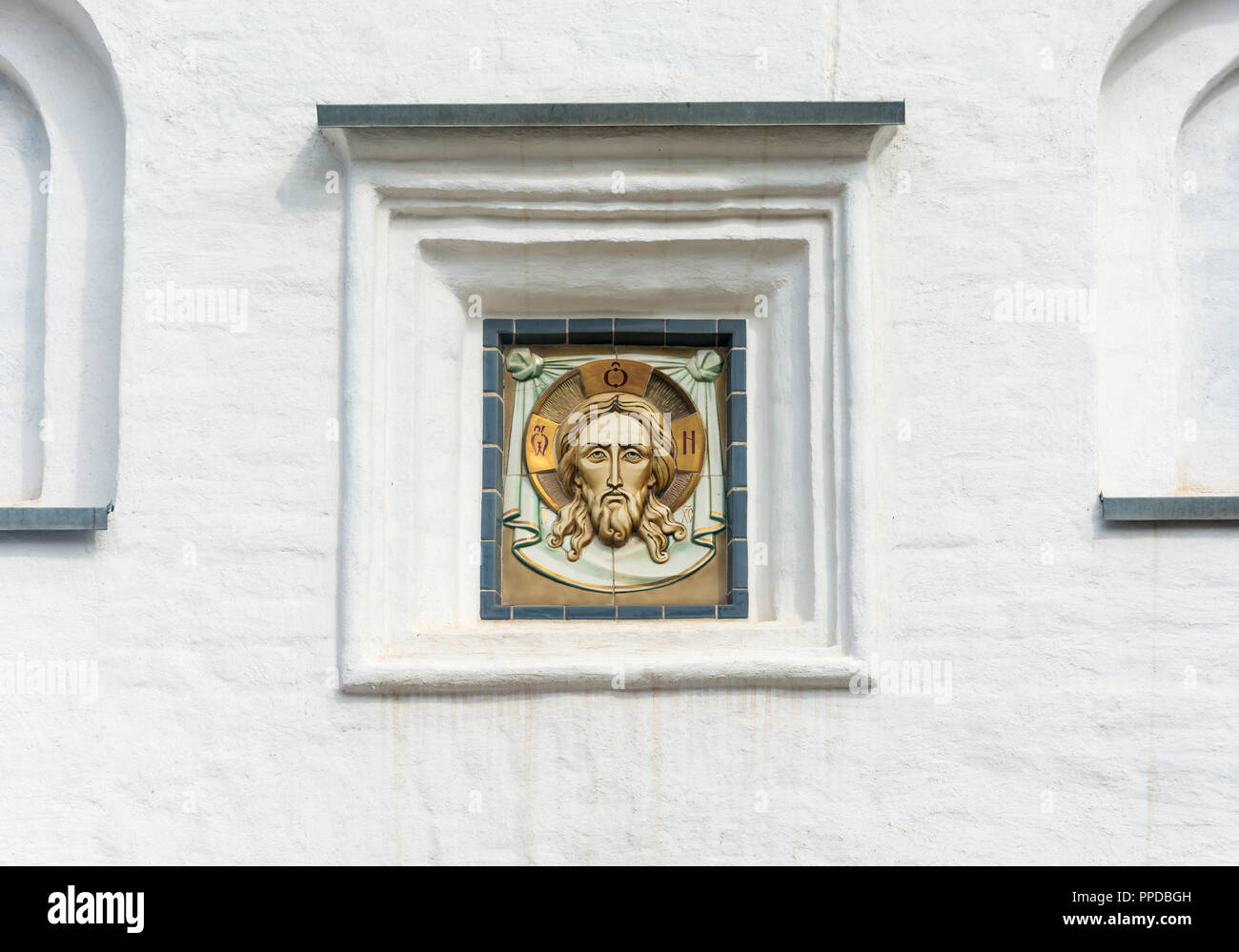 Not the big icon, encased in a white wall of the Spaso-Preobrazhensky Solovetsky monastery, Arkhangelsk oblast, Russia. Stock Photo