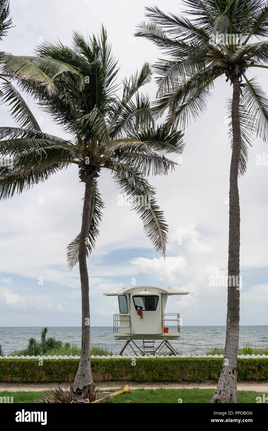A towel hangs over the window of an elevated coast life guard hut shack Palm Beach Florida Stock Photo