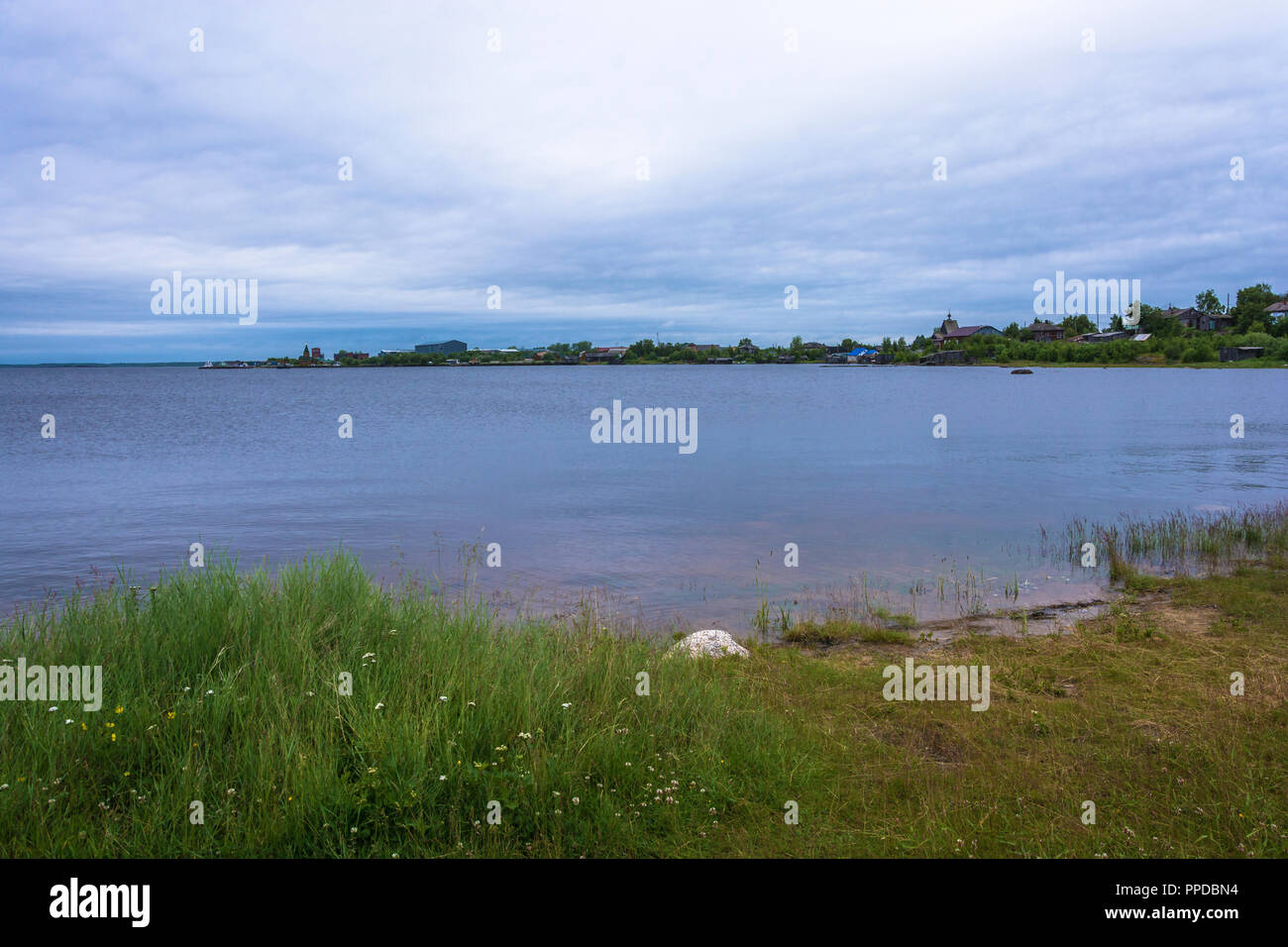 View of the village Rabocheostrovsk in the summer cloudy day, Karelia, Russia. Stock Photo