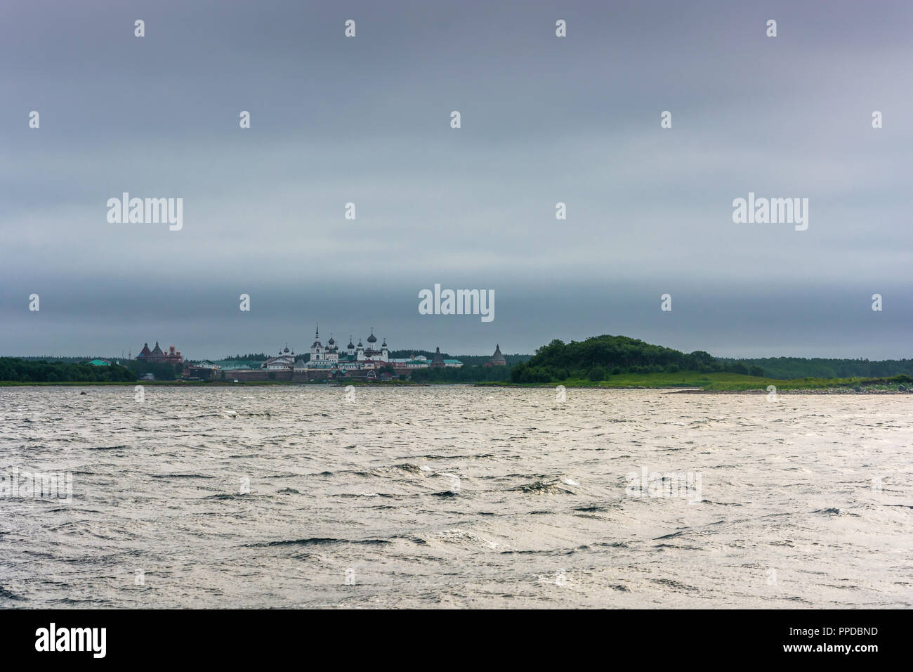 View of the Spaso-Preobrazhensky Solovetsky monastery with Onega bay on a cloudy day, Arkhangelsk oblast, Russia. Stock Photo