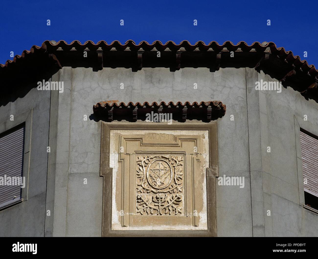 Coat of arms of the Inquisition. Remains of the facade of the House of the Inquisition, detail. It was built in 1438. Mota del Cuervo. Cuenca province, Castile-La Mancha, Spain. Stock Photo