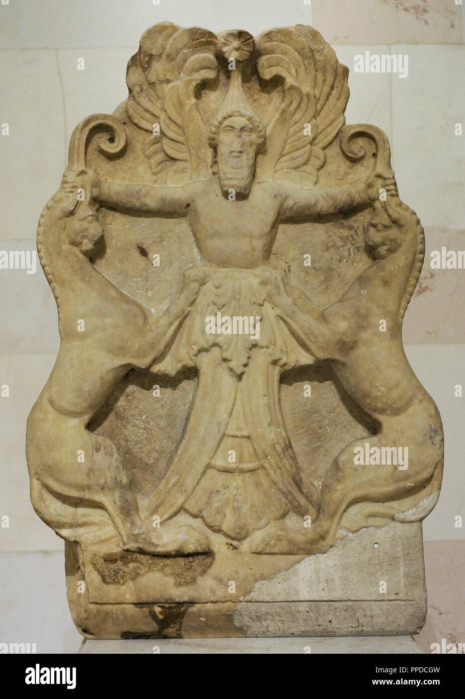 Greek art. Acroterium or architectural decorative element with a relief depicting Arimaspian (winged-deity) holding griffins by their horns. 3rd century BC. Marble. The state Hermitage Museum. Saint Petersburg. Russia. Stock Photo