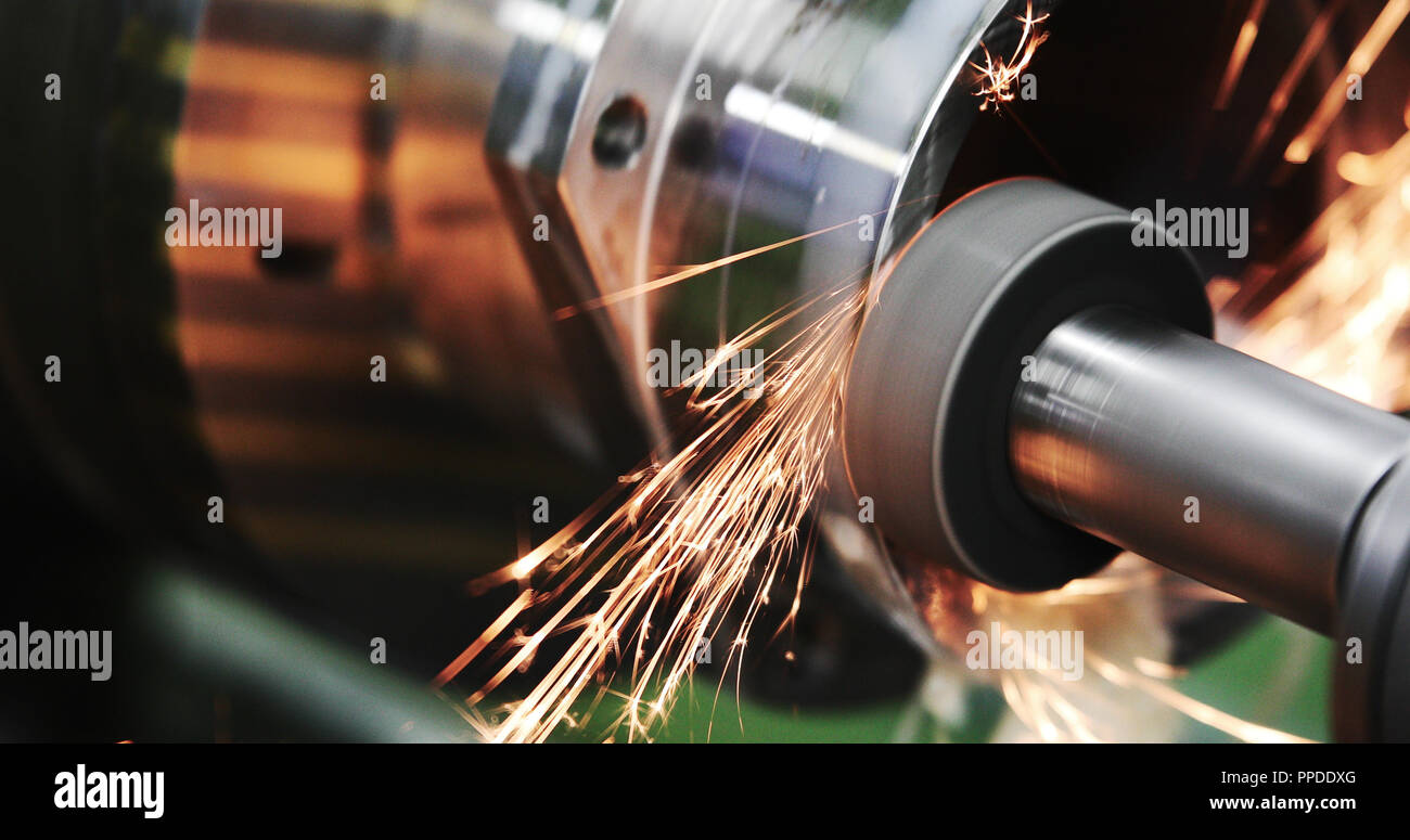 Finishing metal working on high precision grinding machine in workshop Stock Photo