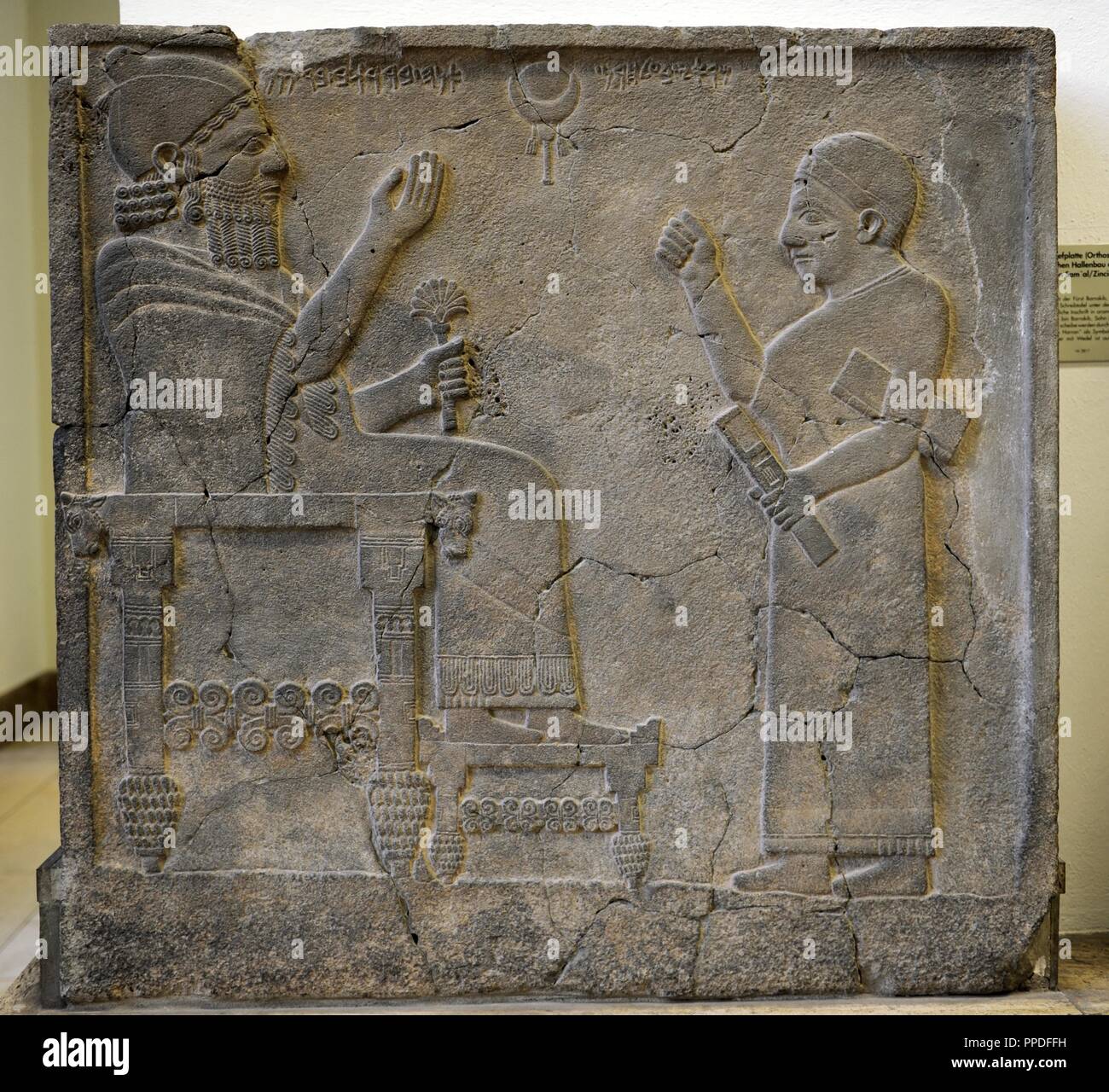 Hittite art. Orthostat or stele of King Bar-Rakib (Barrakit 744-727 BC)  sitting on the throne .750 BC. Zone of Sma'al /Zincirli (Turkey) to South of Turkey. Detail. Pergamon Museum. Museum Island. Berlin. Germany. Stock Photo