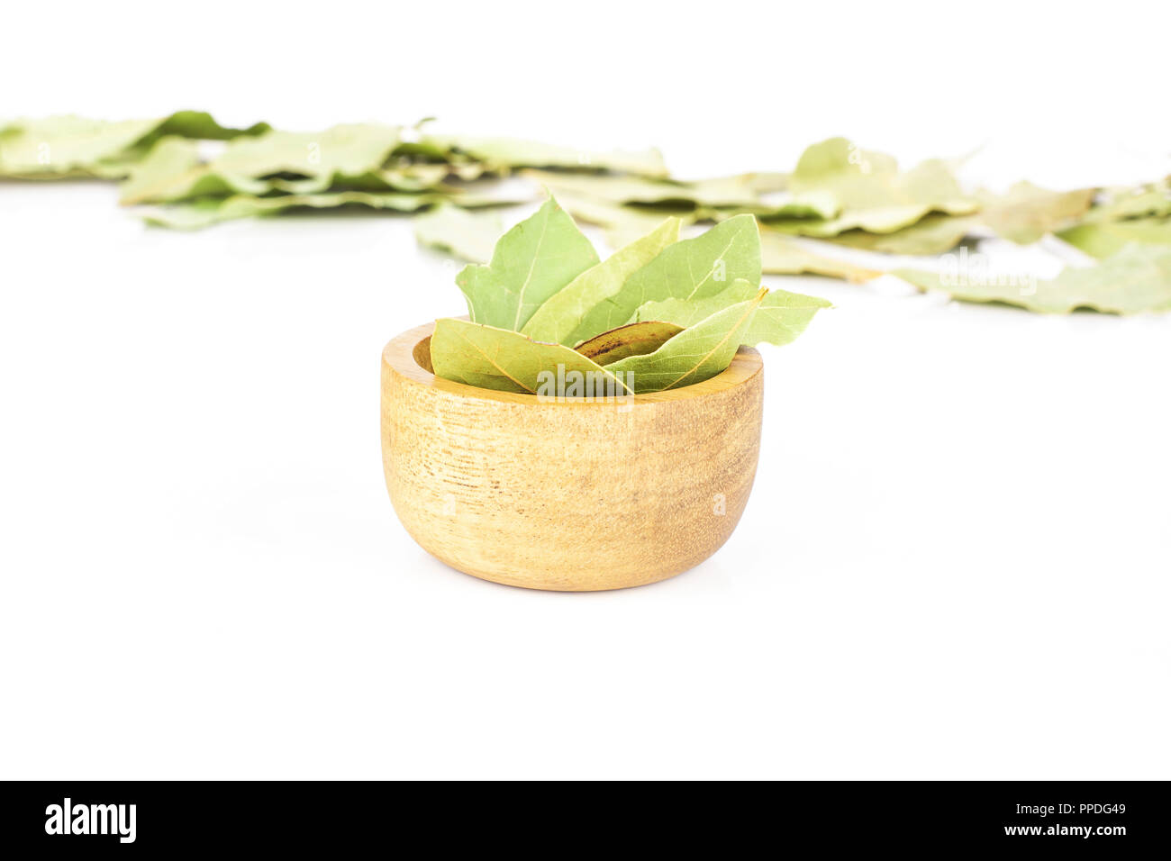 Lot of whole dry olive green bay laurel leaves selective front focus