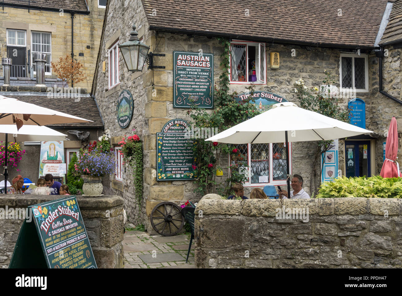 Colourful frontage of the Tiroler Stuberl, an Austrian coffee shop and sausage importer, Bakewell, Derbyshire, UK Stock Photo