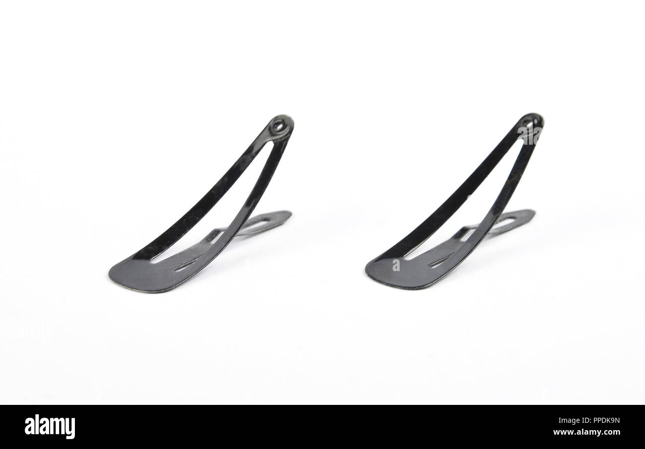 Bobby pins on white background Stock Photo - Alamy
