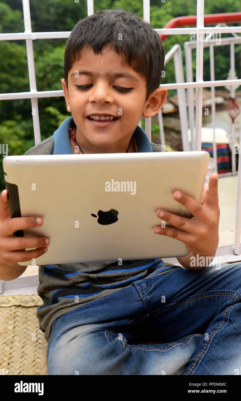 Boy using Apple(Brand Name) tablet Stock Photo Alamy