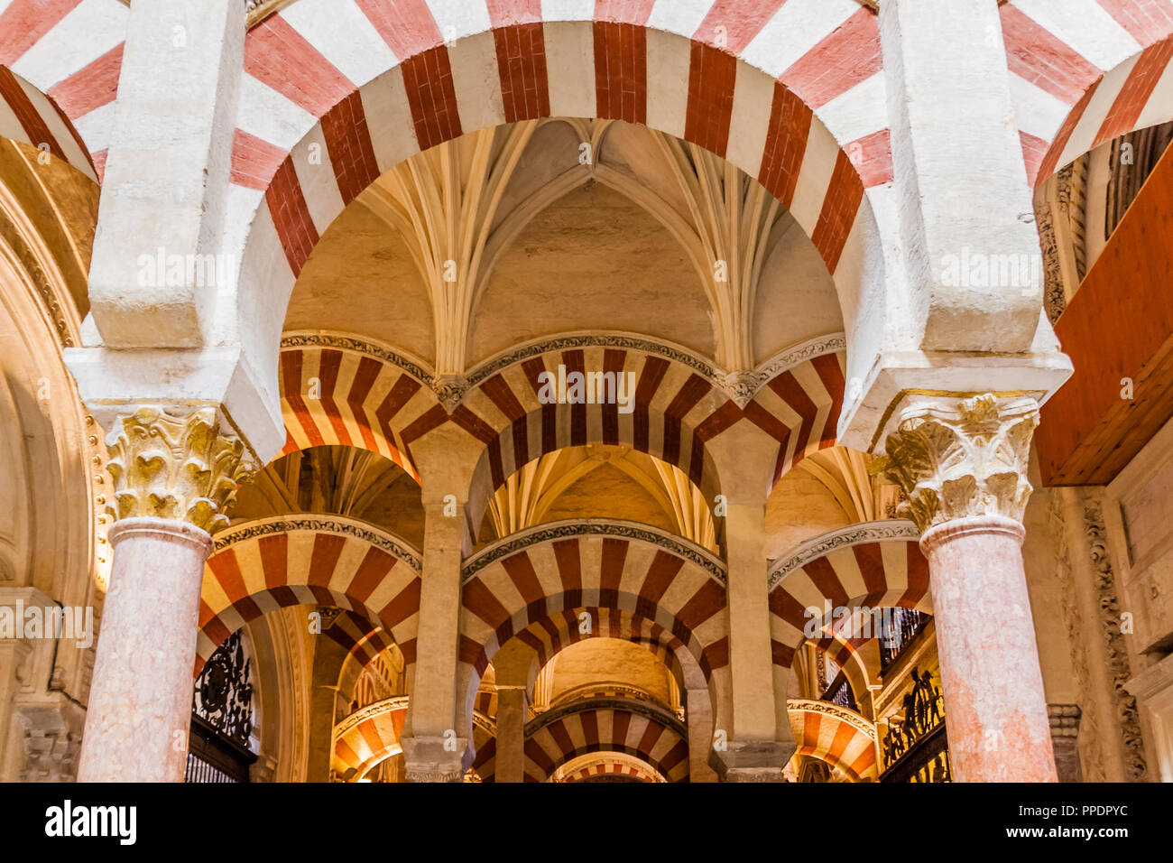 Pillars and arches in the Mezquita Cathedral, also known as the Great Mosque of Cordoba, Cordoba, Spain. Stock Photo