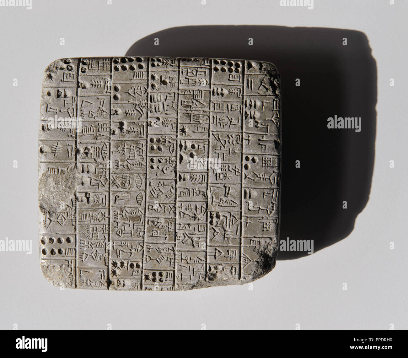 Cuneiform document in the Institute of Assyriology and Hittite Studies at the Ludwig Maximilian University of Munich: the picture shows a stone monument from old Sumerian time, approximately the 24th century BC, in Sumerian language, it is a legal document on land. The original is in the University of Pennsylvania Museum, Philadelphia. Stock Photo
