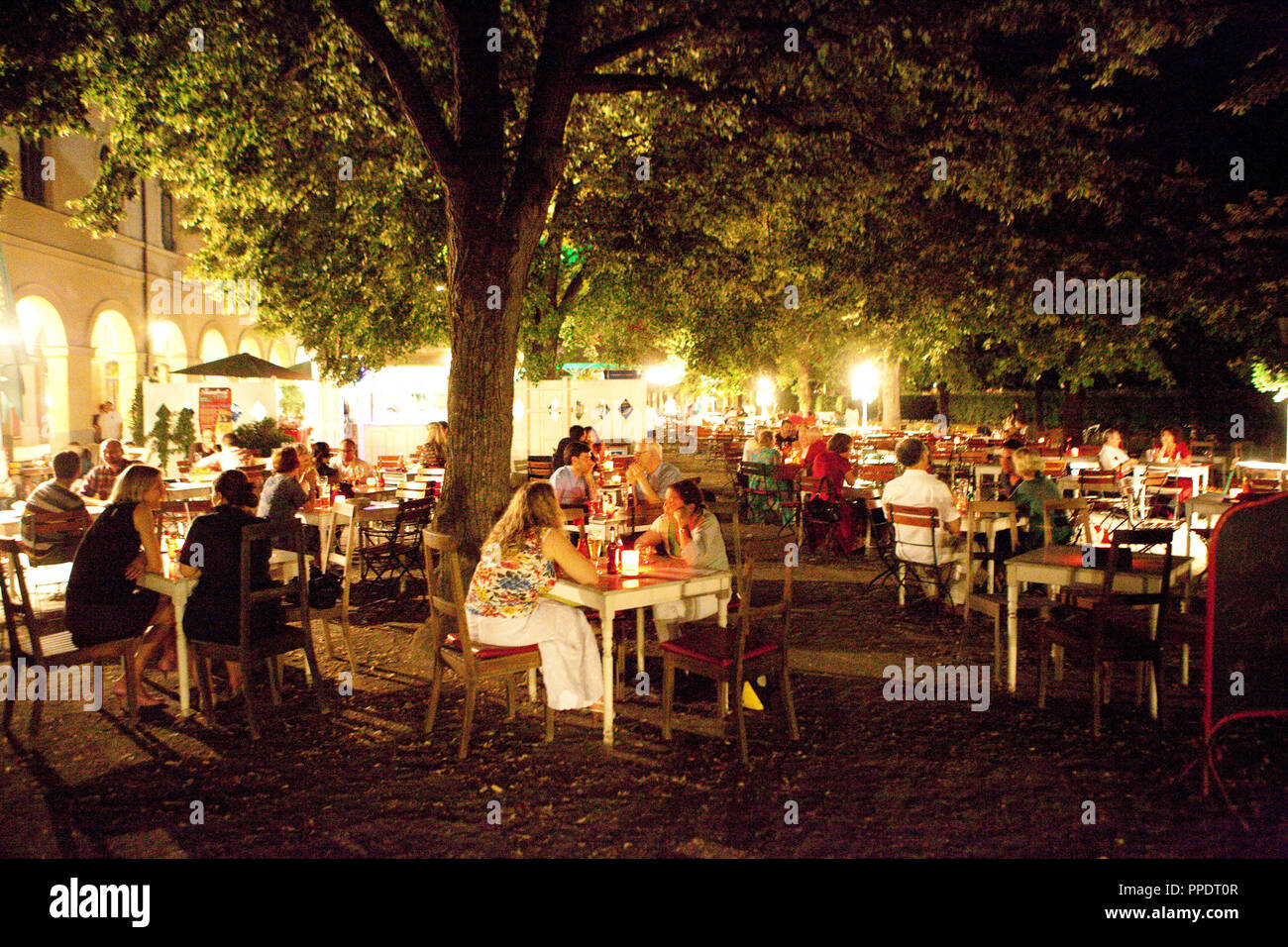 Guests sitting on the terrace of Cafe Tambosi in the Hofgarten. Stock Photo