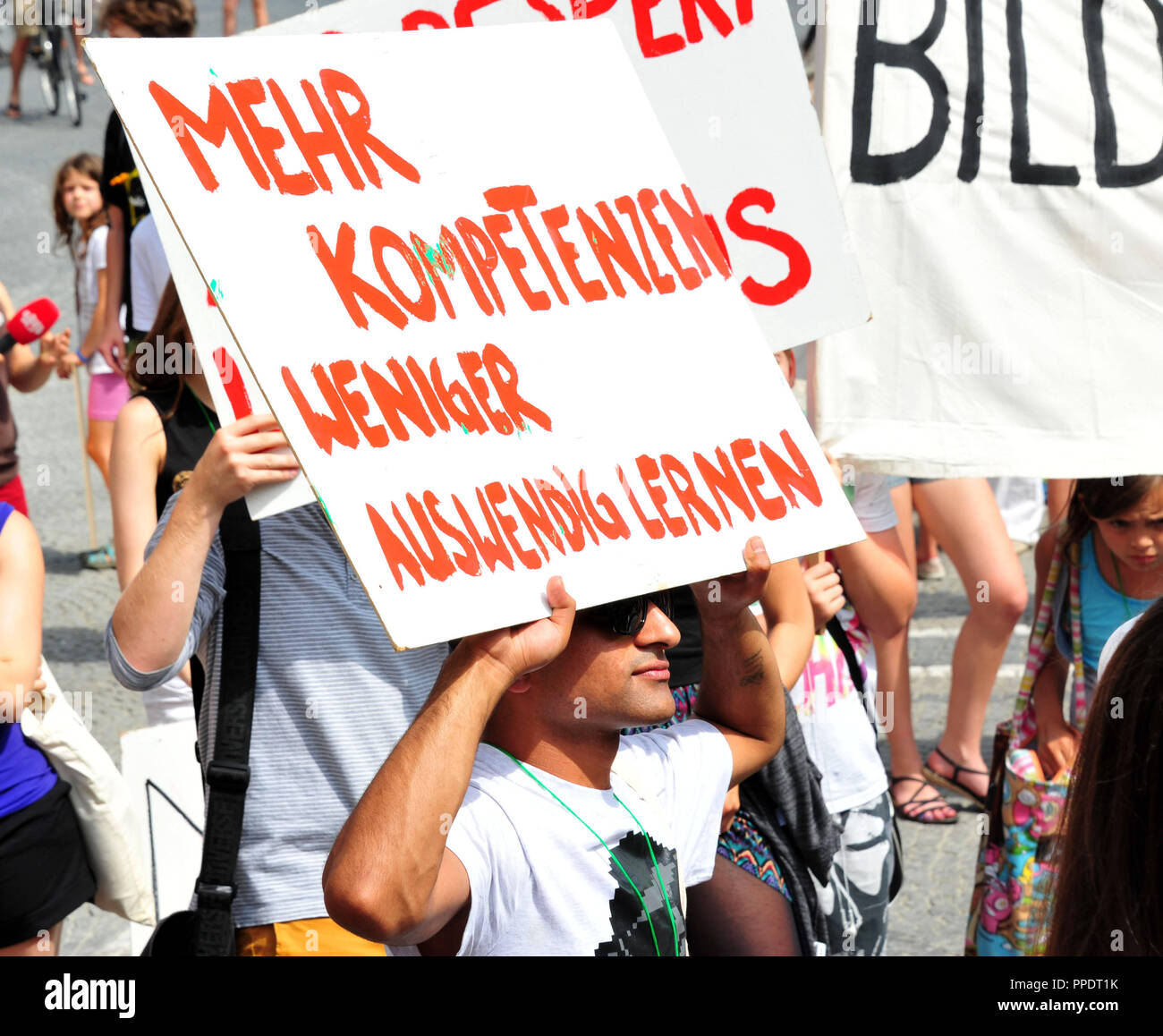 About 250 students demonstrate under the motto "We are many" on the Odeonsplatz in Munich for improved educational concepts and more student rights. In the picture a sign demands "More skills. Less memorizing". Stock Photo