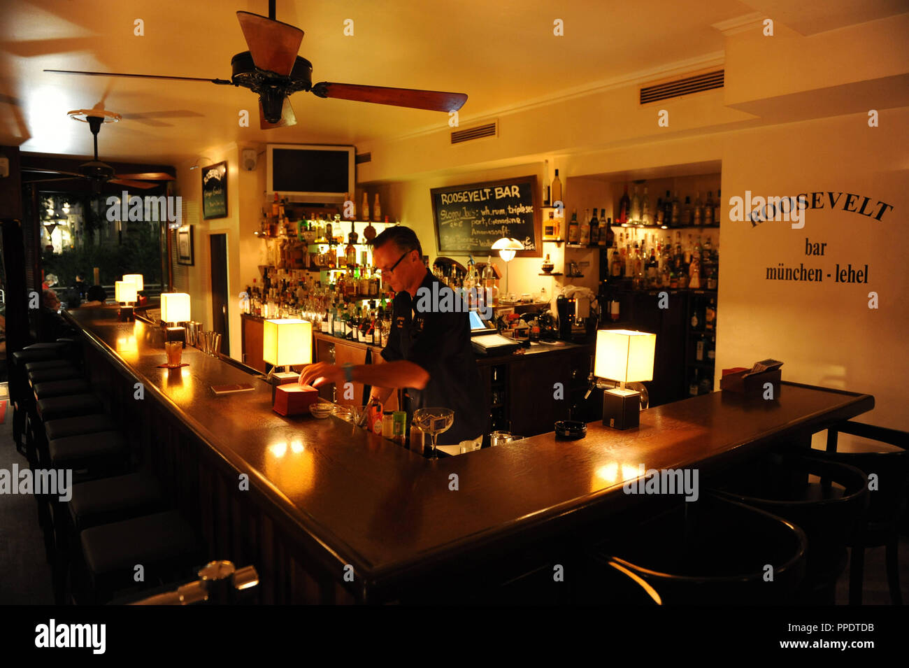 The bar "Roosevelt" on the Thierschplatz im Lehel is specialized mainly in  rum Stock Photo - Alamy