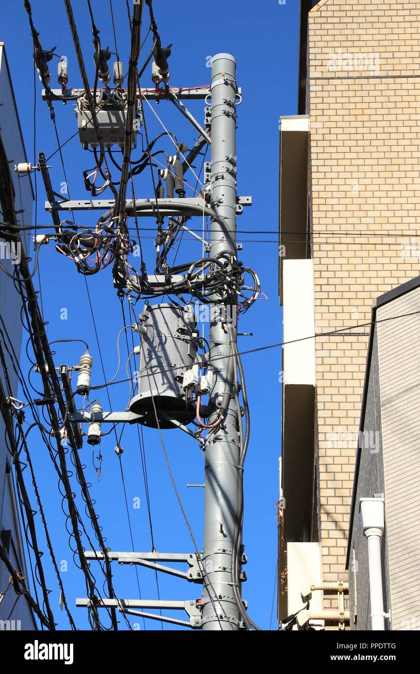 Electricity network in Japan - typical city electric pole in Tokyo. Stock Photo