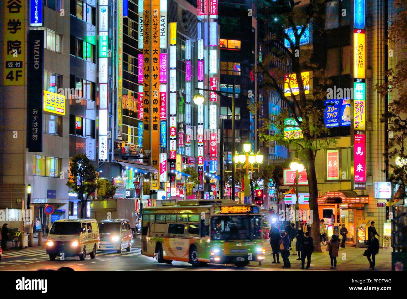 TOKYO, JAPAN - NOVEMBER 29, 2016: People visit night Ikebukuro district of Tokyo, Japan. Tokyo is the capital city of Japan. 37.8 million people live  Stock Photo