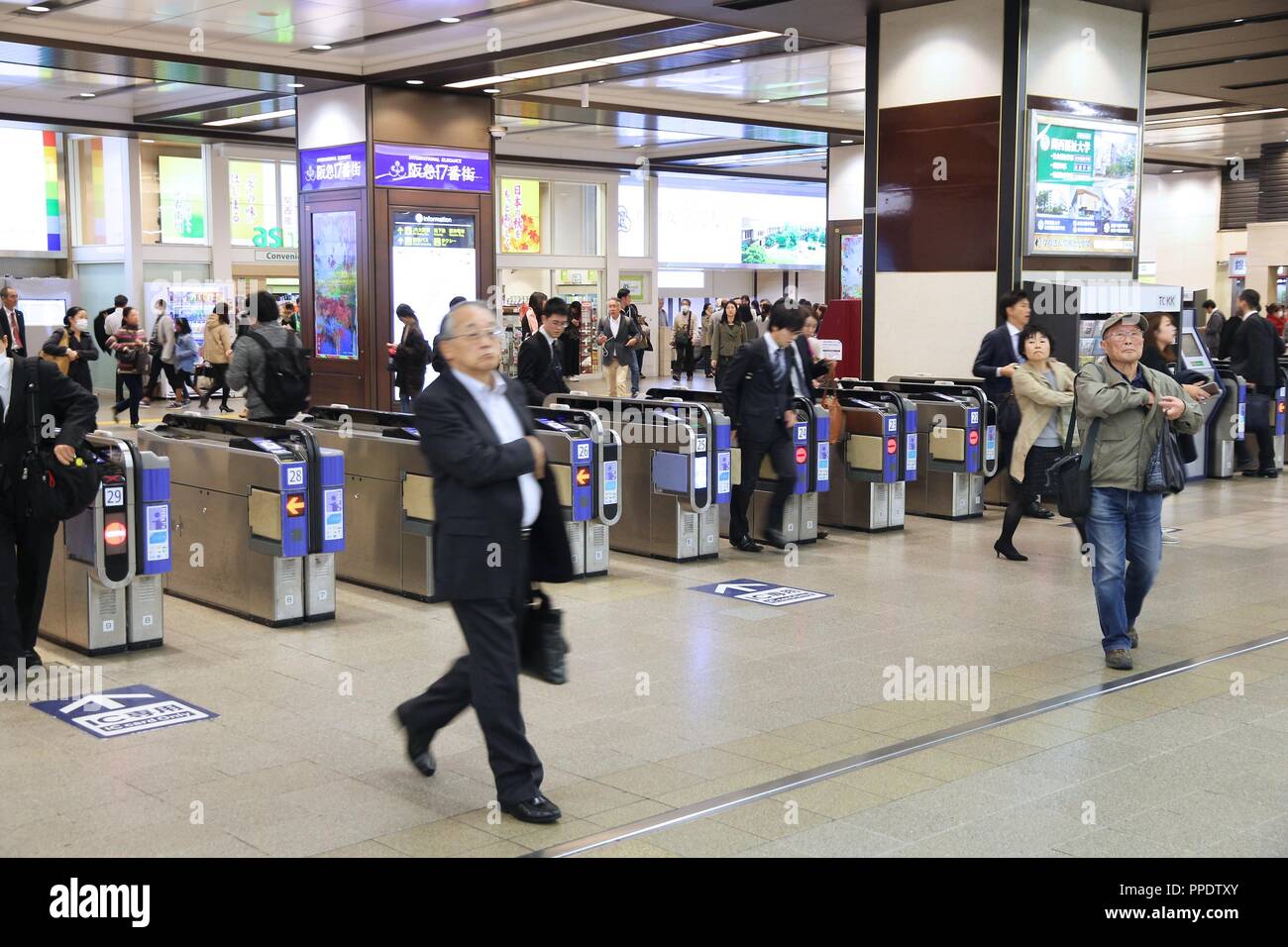 OSAKA, JAPAN - NOVEMBER 22, 2016: Passengers hurry at Hankyu Umeda Station in Osaka, Japan. Hankyu Umeda Station opened in 1910 and is operated by Han Stock Photo