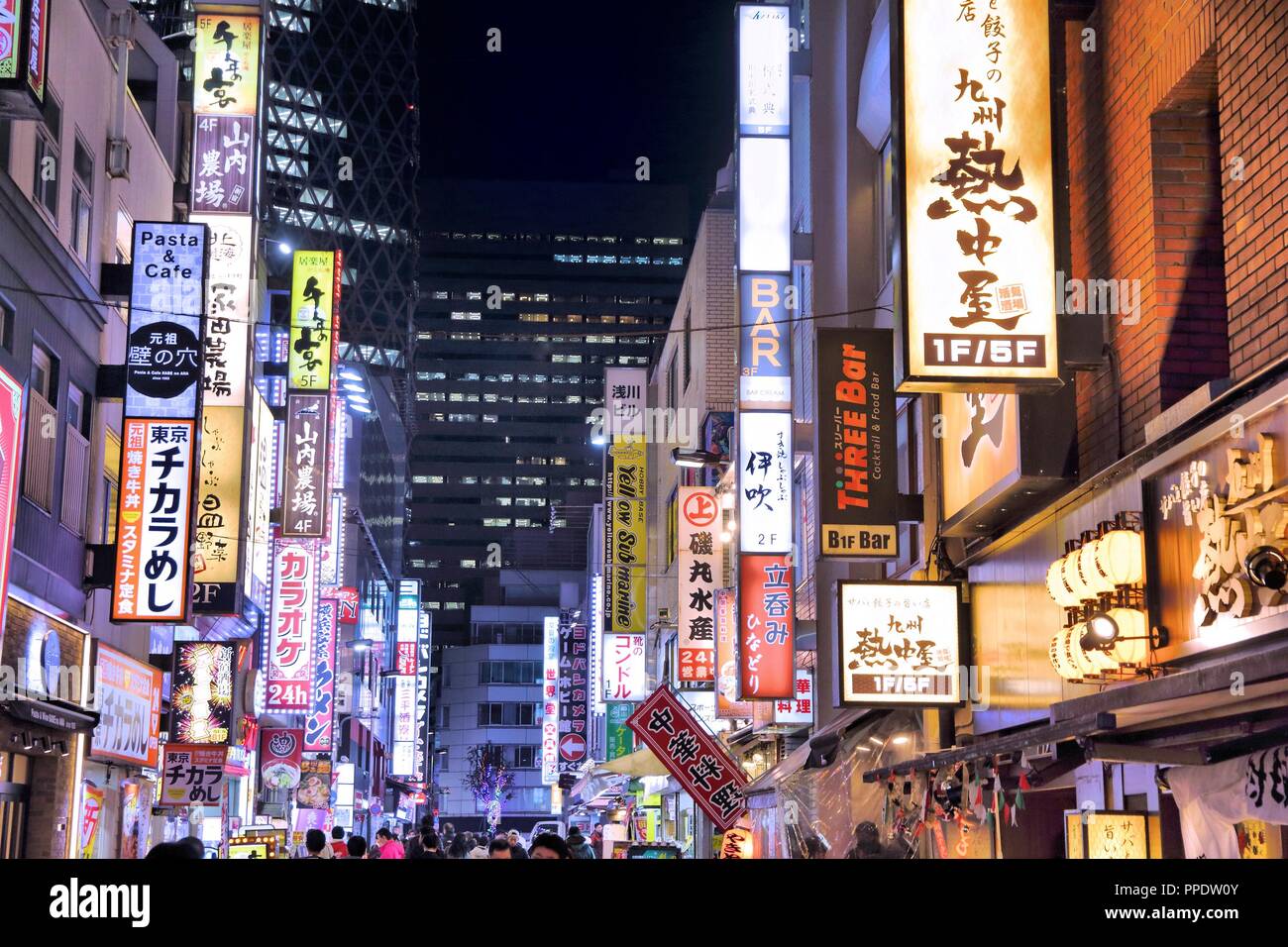TOKYO, JAPAN - DECEMBER 2, 2016: Neon lights of Shinjuku district of Tokyo, Japan. Tokyo is the capital city of Japan. 37.8 million people live in its Stock Photo