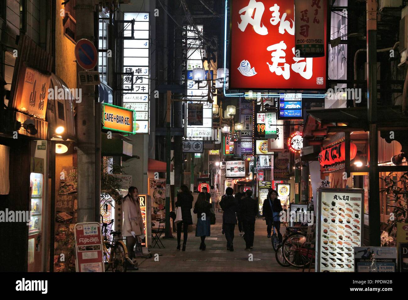 OSAKA, JAPAN - NOVEMBER 22, 2016: People visit restaurants along shopping street in Umeda district, Osaka. Osaka belongs to 2nd largest metropolitan a Stock Photo