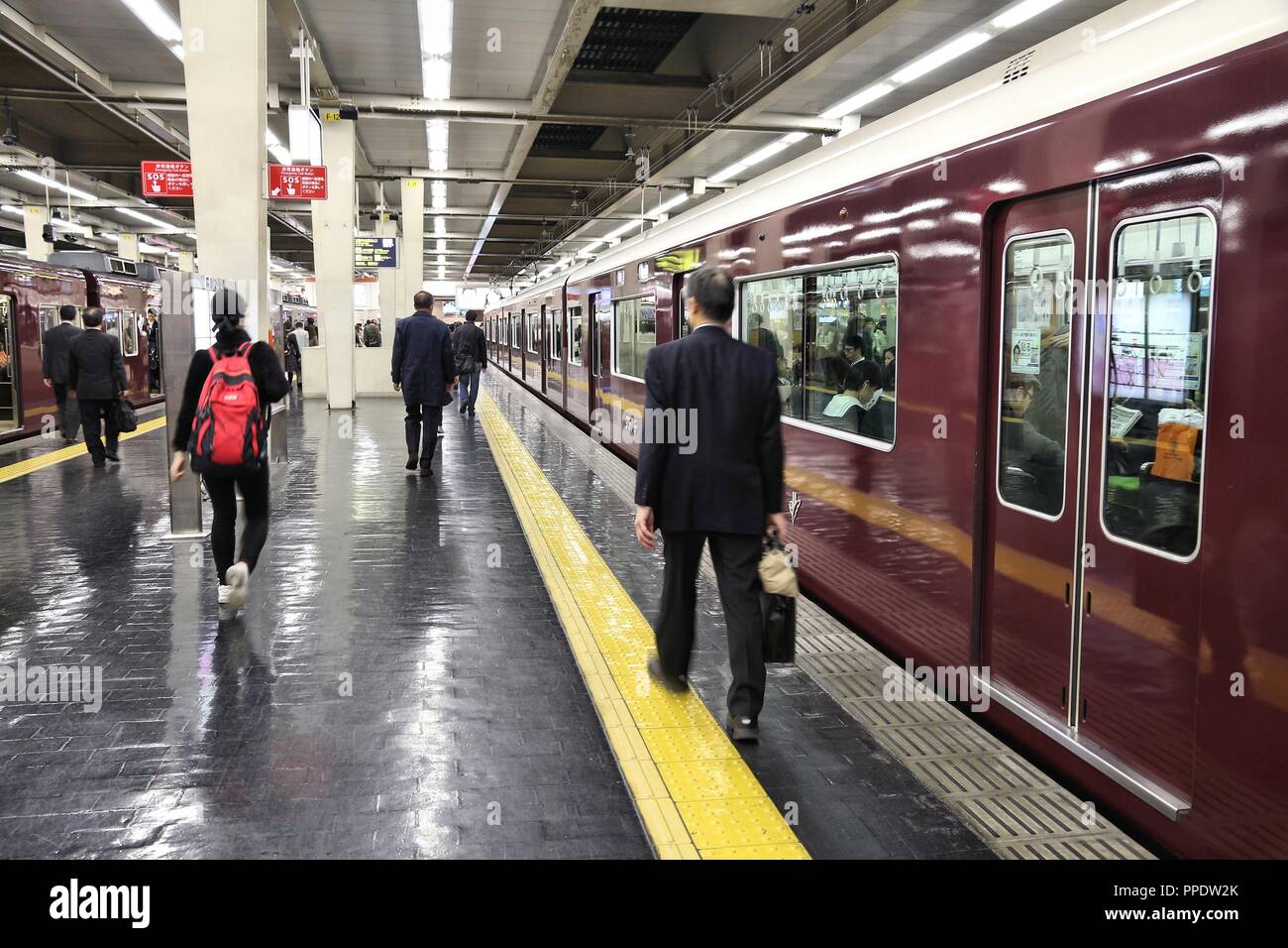 OSAKA, JAPAN - NOVEMBER 22, 2016: Passengers hurry at Hankyu Umeda Station in Osaka, Japan. Hankyu Railway station was opened in 1910. Stock Photo