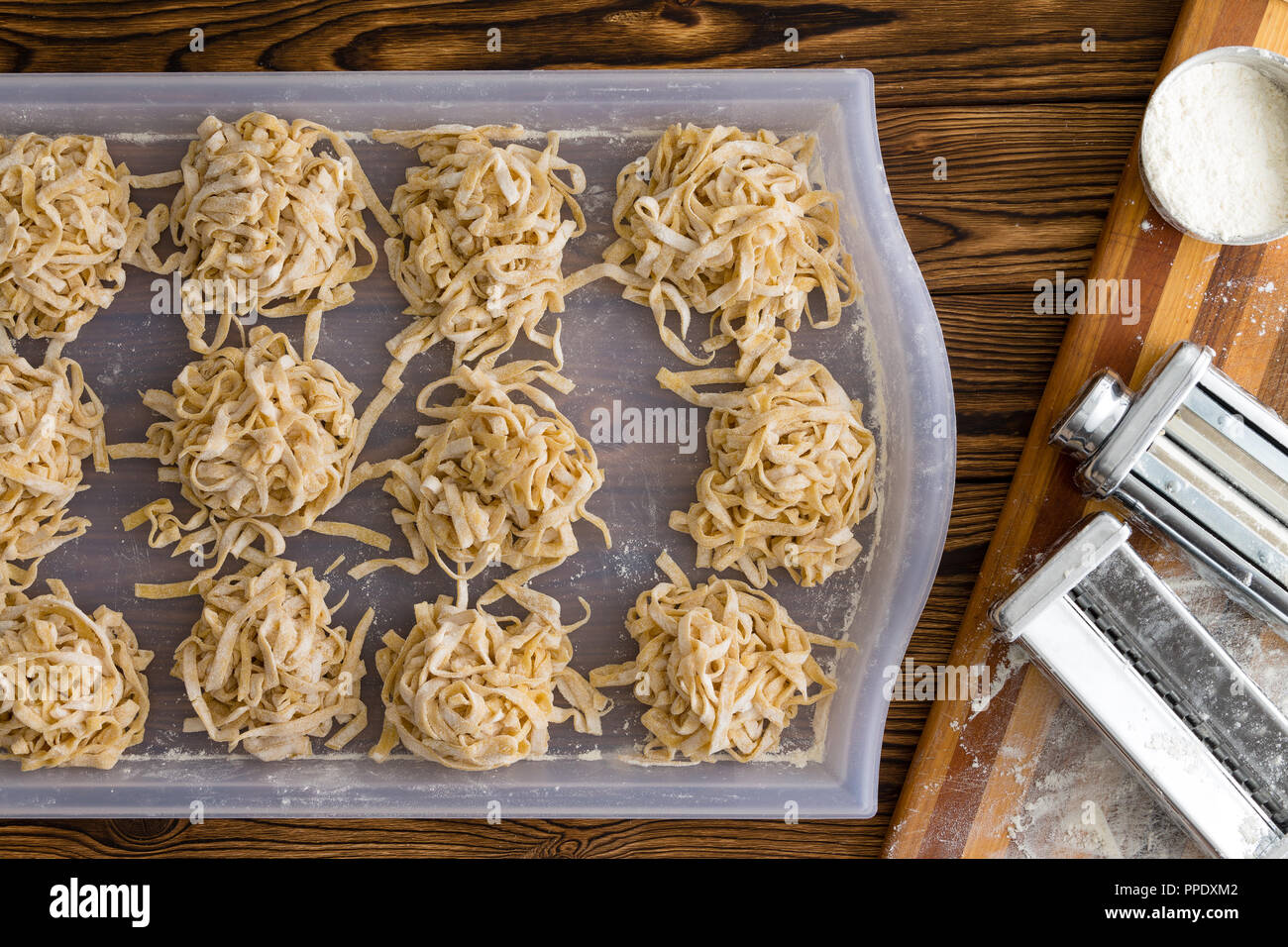 Making homemade fresh fettuccine pasta with an overhead view of a