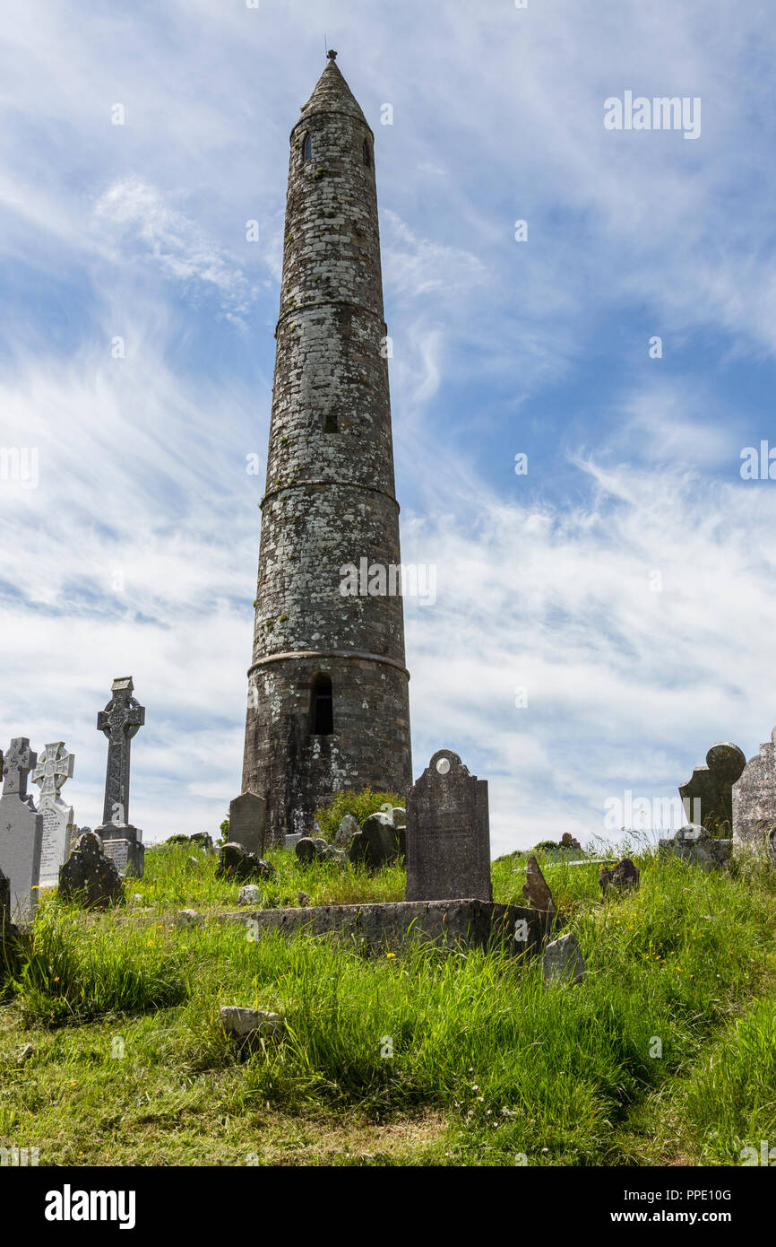 The round tower near the ruins of Ardmore Cathedral, County Waterford in the Republic of Ireland. Stock Photo