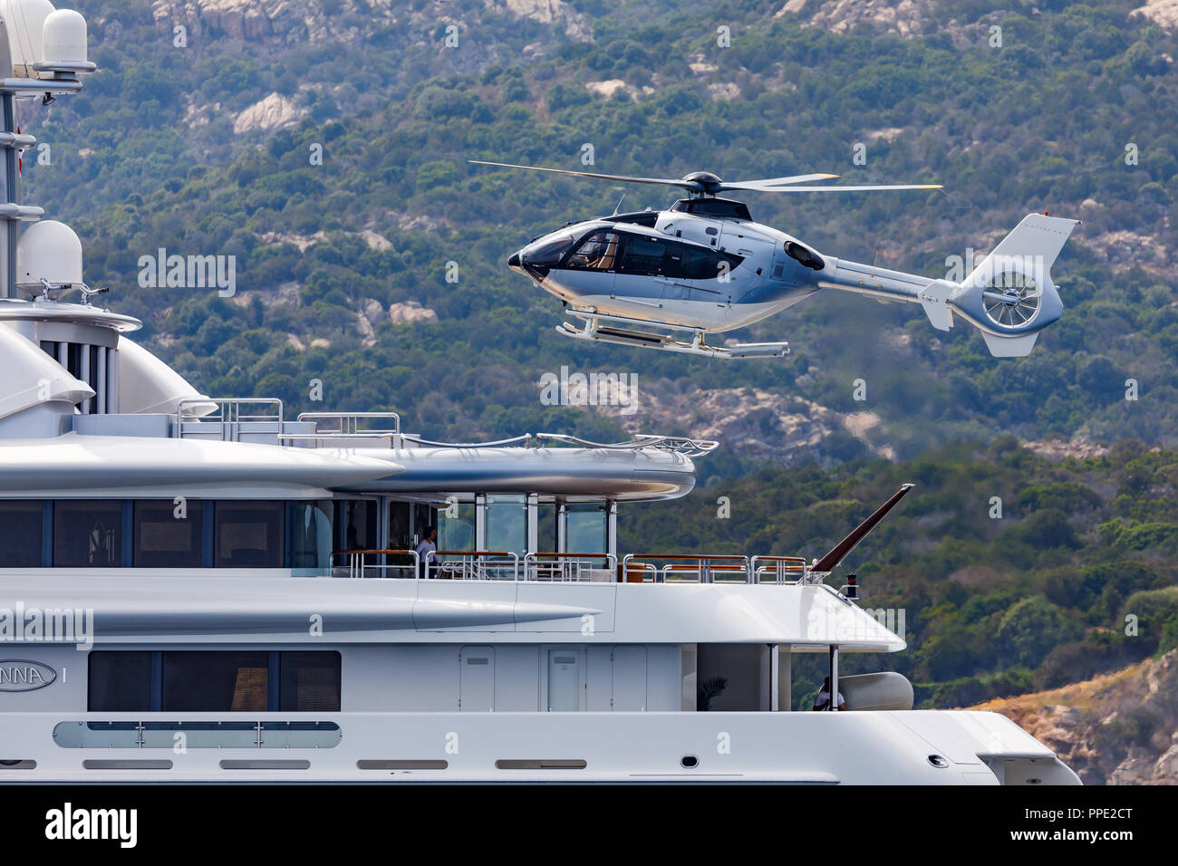 Helicopter landing on a luxury yacht Stock Photo