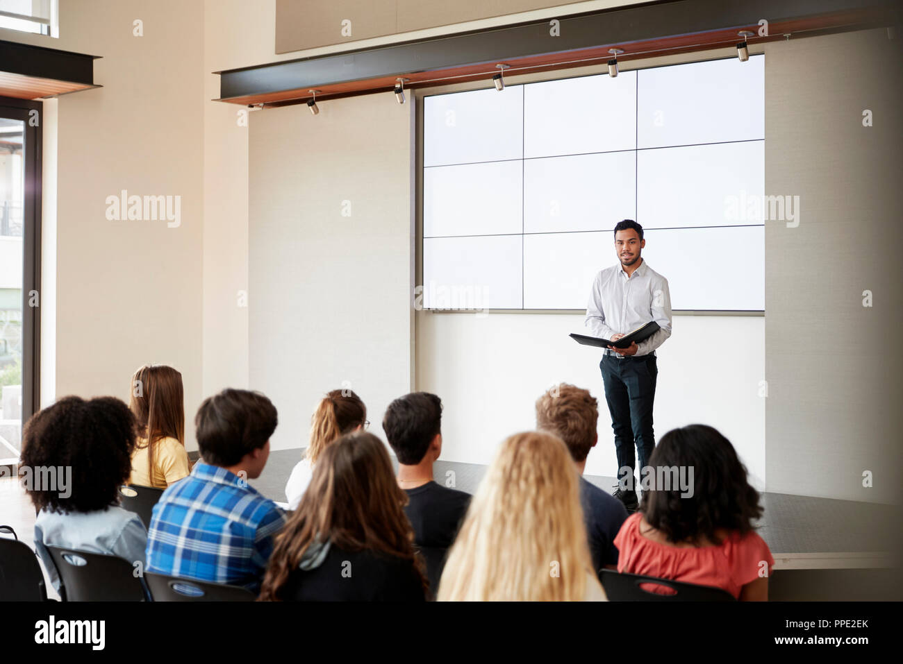 giving a speech to high school students