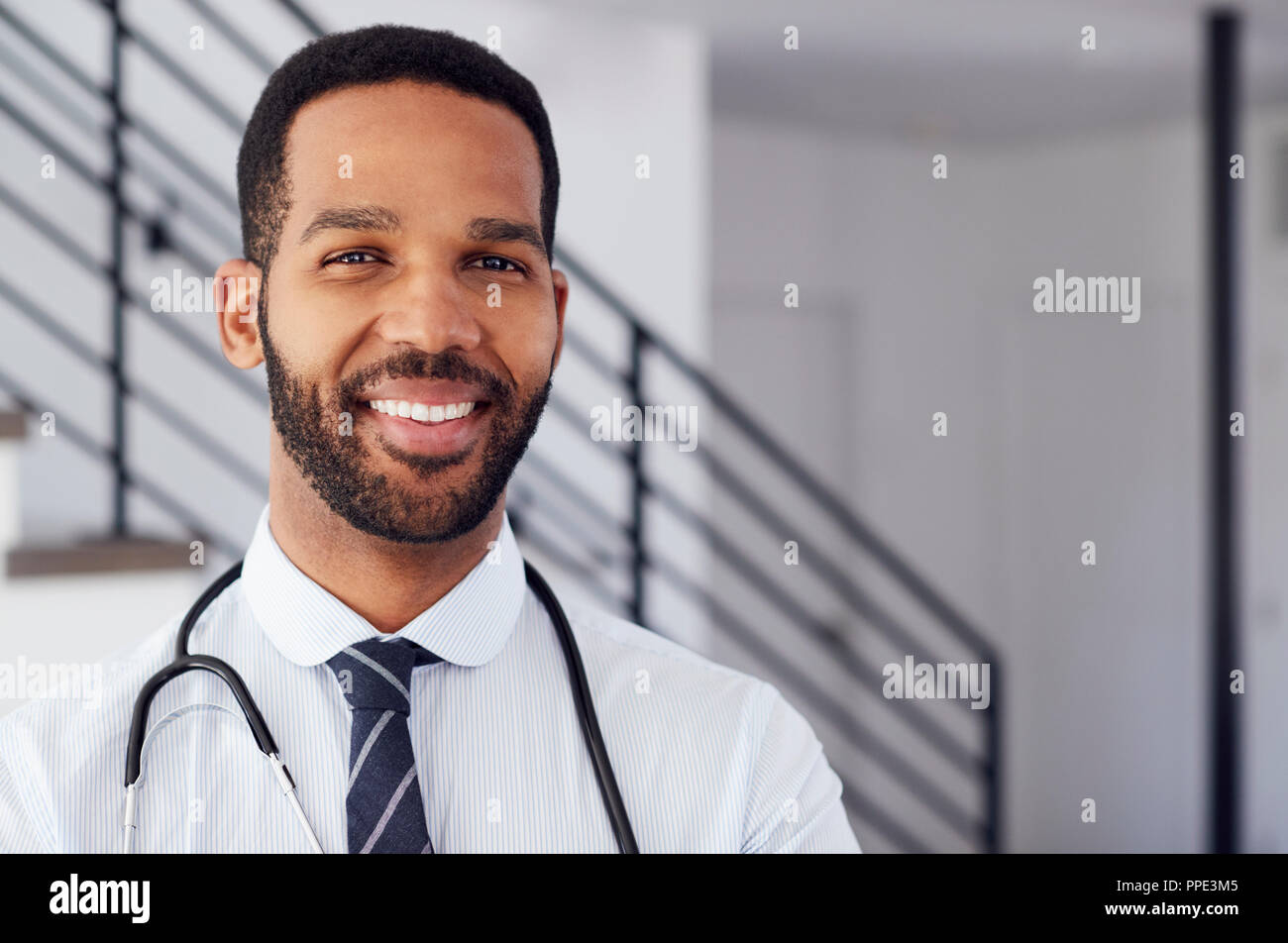 Portrait Of Male Doctor With Stethoscope In Hospital Stock Photo