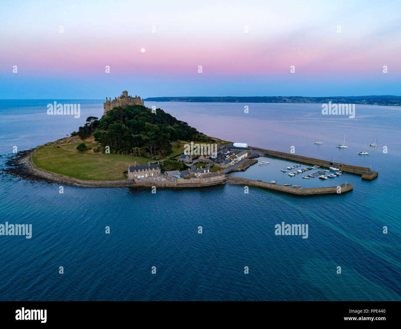 Mid level drone shot of St Michaels Mount Cornwall with the full moon
