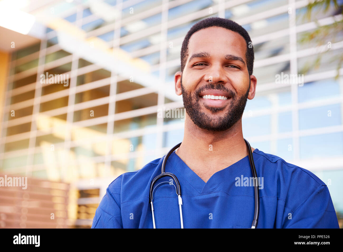Smiling black male healthcare worker, head and shoulders Stock Photo